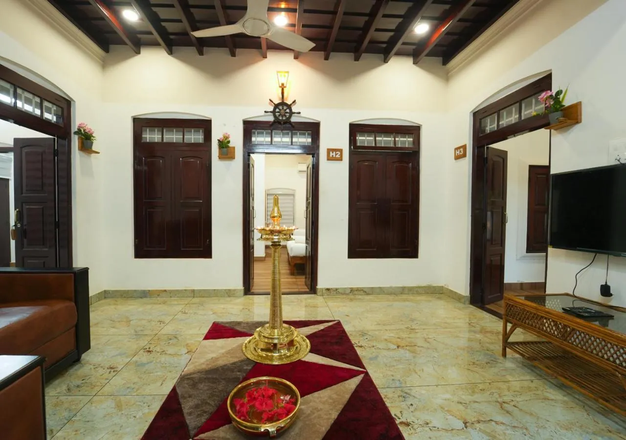 Communal lounge/ TV room in Pop Tavern Kovalam Beach Villa by VOYE HOMES