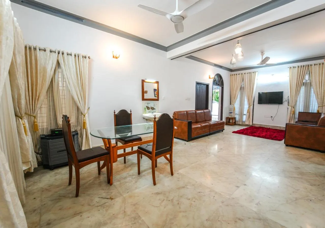 TV and multimedia in Pop Tavern Kovalam Beach Villa by VOYE HOMES