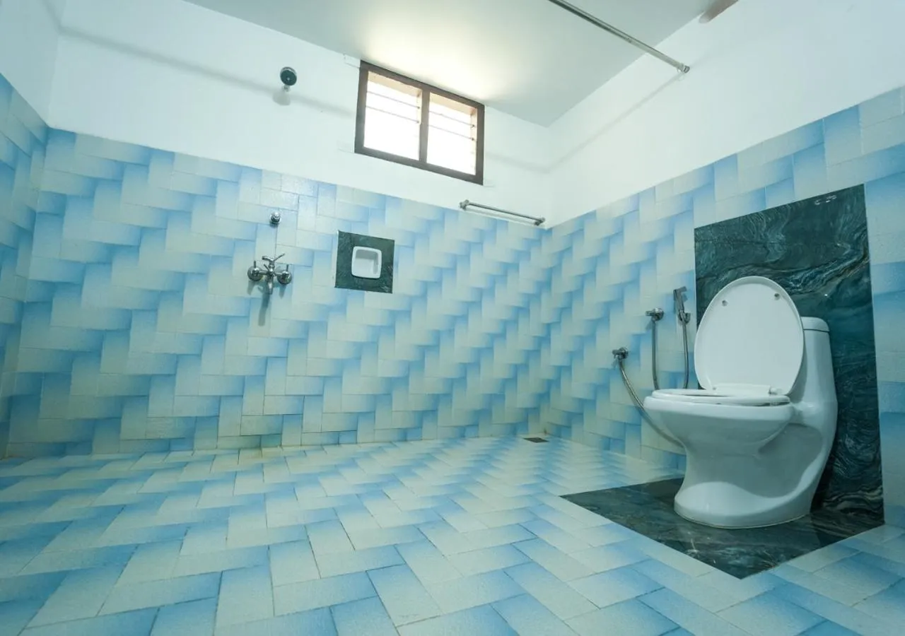 Toilet in Pop Tavern Kovalam Beach Villa by VOYE HOMES