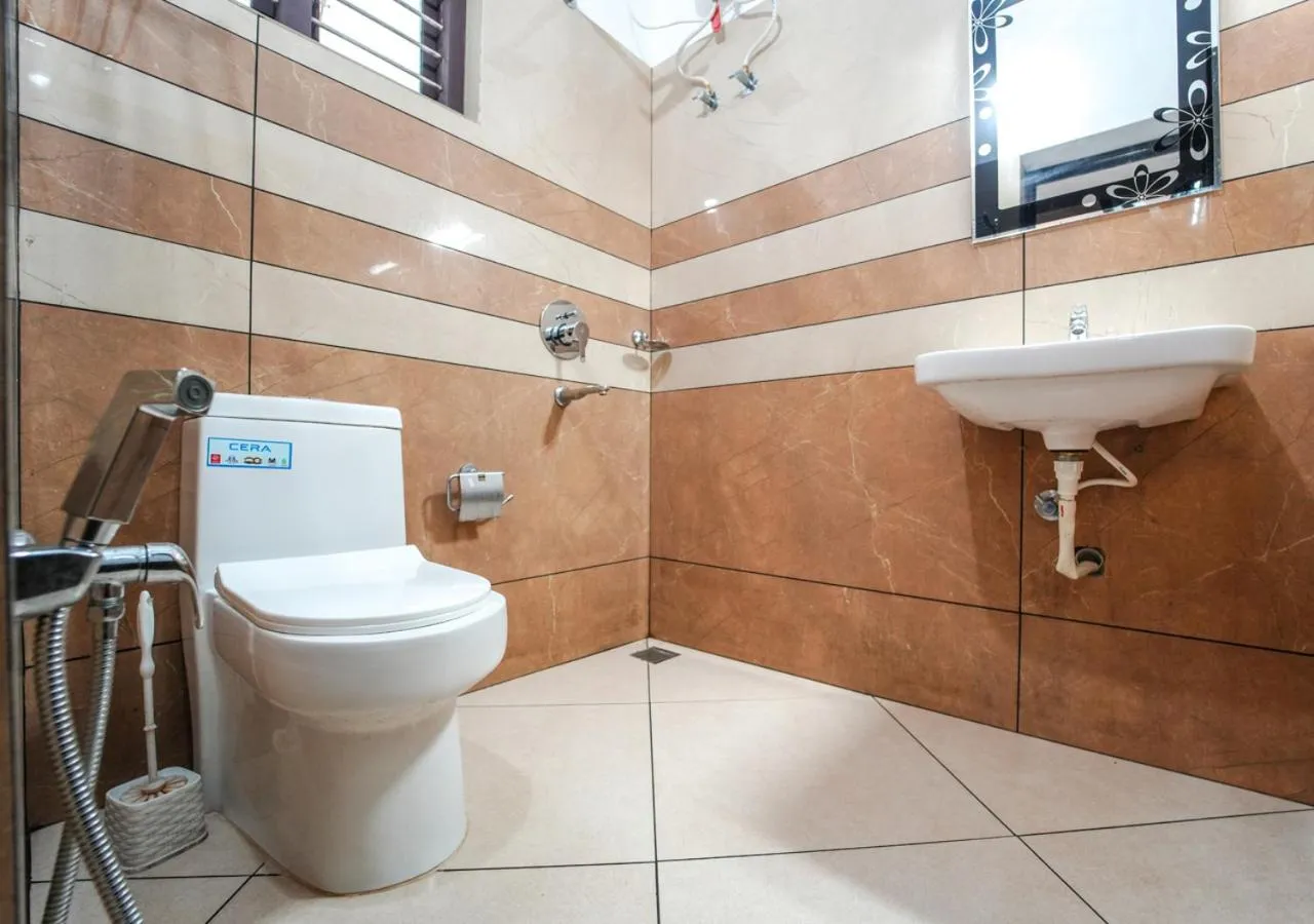 Shower in Pop Tavern Kovalam Beach Villa by VOYE HOMES