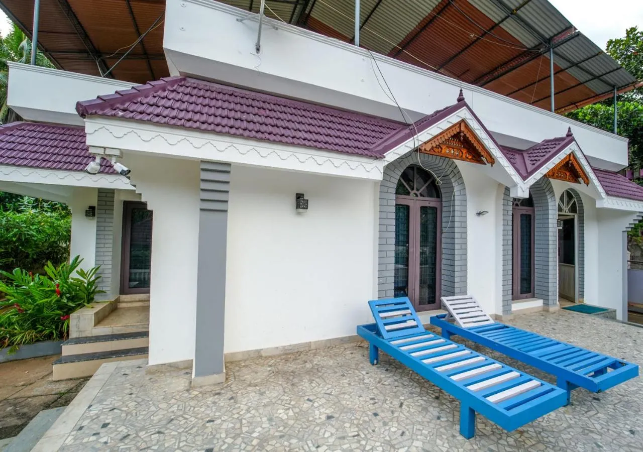 sunbed in Pop Tavern Kovalam Beach Villa by VOYE HOMES