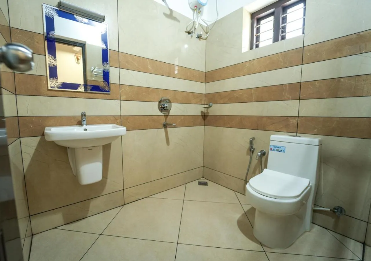 Bathroom in Pop Tavern Kovalam Beach Villa by VOYE HOMES