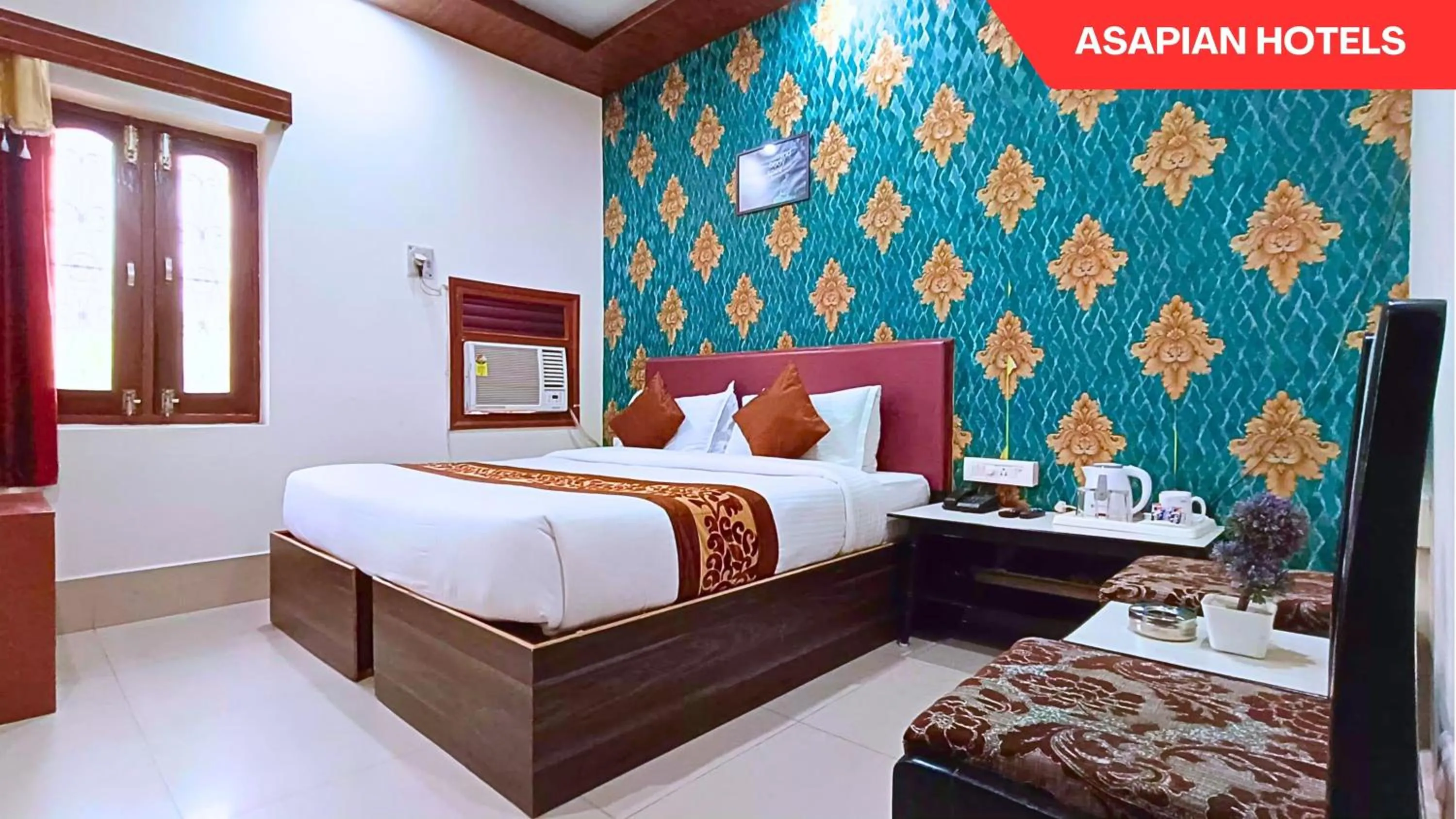 Bed in Hotel Vijay Deluxe