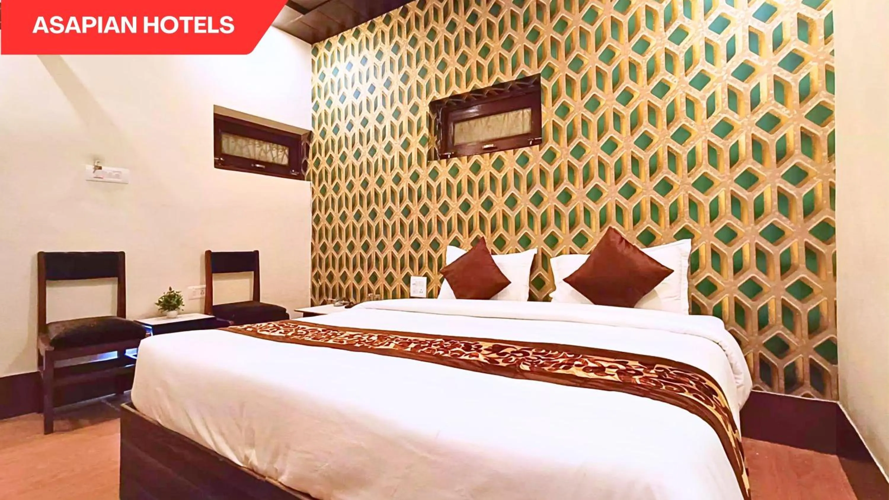 Bed in Hotel Vijay Deluxe