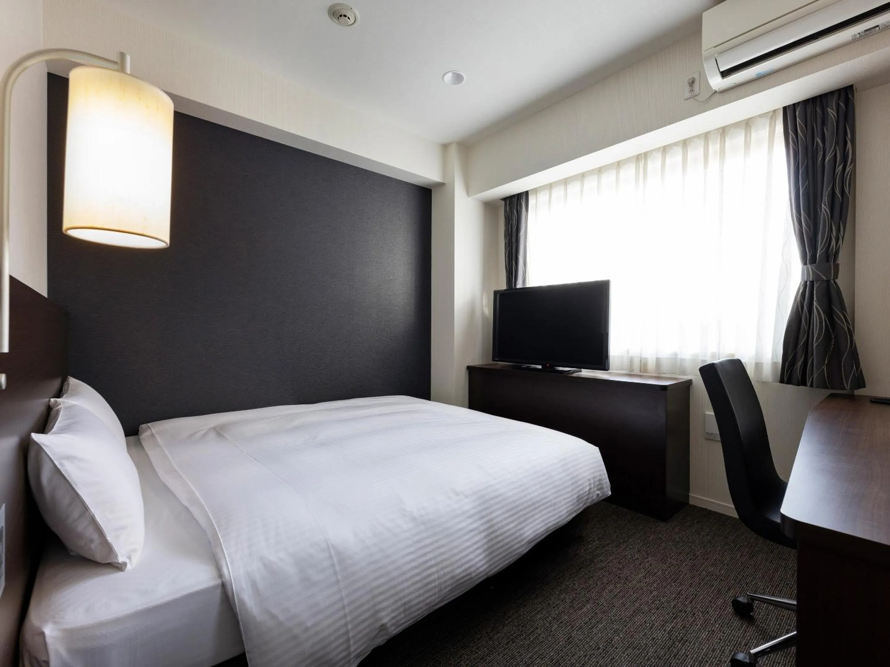 Photo of the whole room, Bed in KOKO HOTEL Osaka Shinsekai - formerly Hotel Wing Premium Osaka Shinsekai