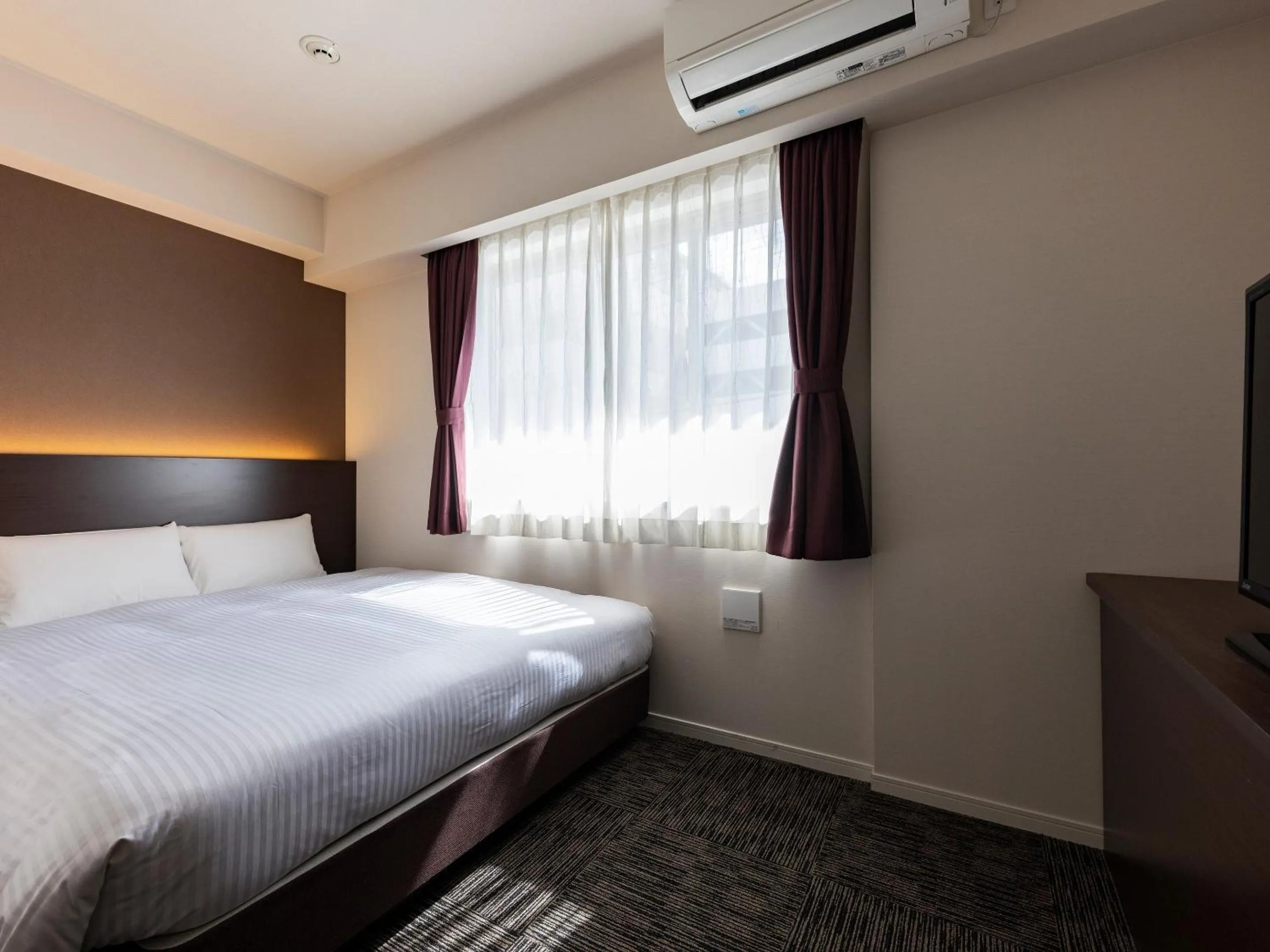 Photo of the whole room, Bed in KOKO HOTEL Osaka Shinsekai - formerly Hotel Wing Premium Osaka Shinsekai