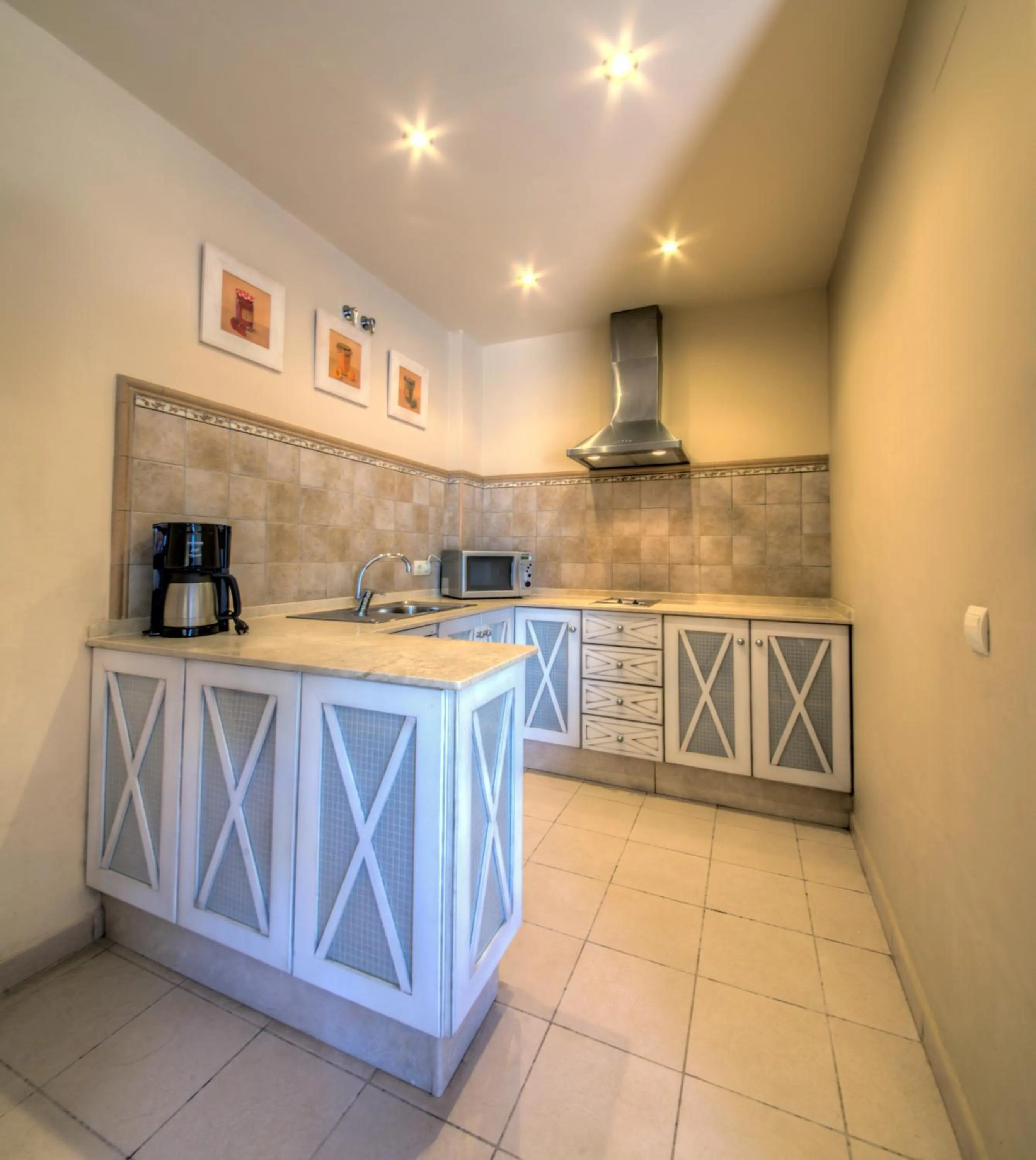 Kitchen or kitchenette in Apartamentos Piedramar
