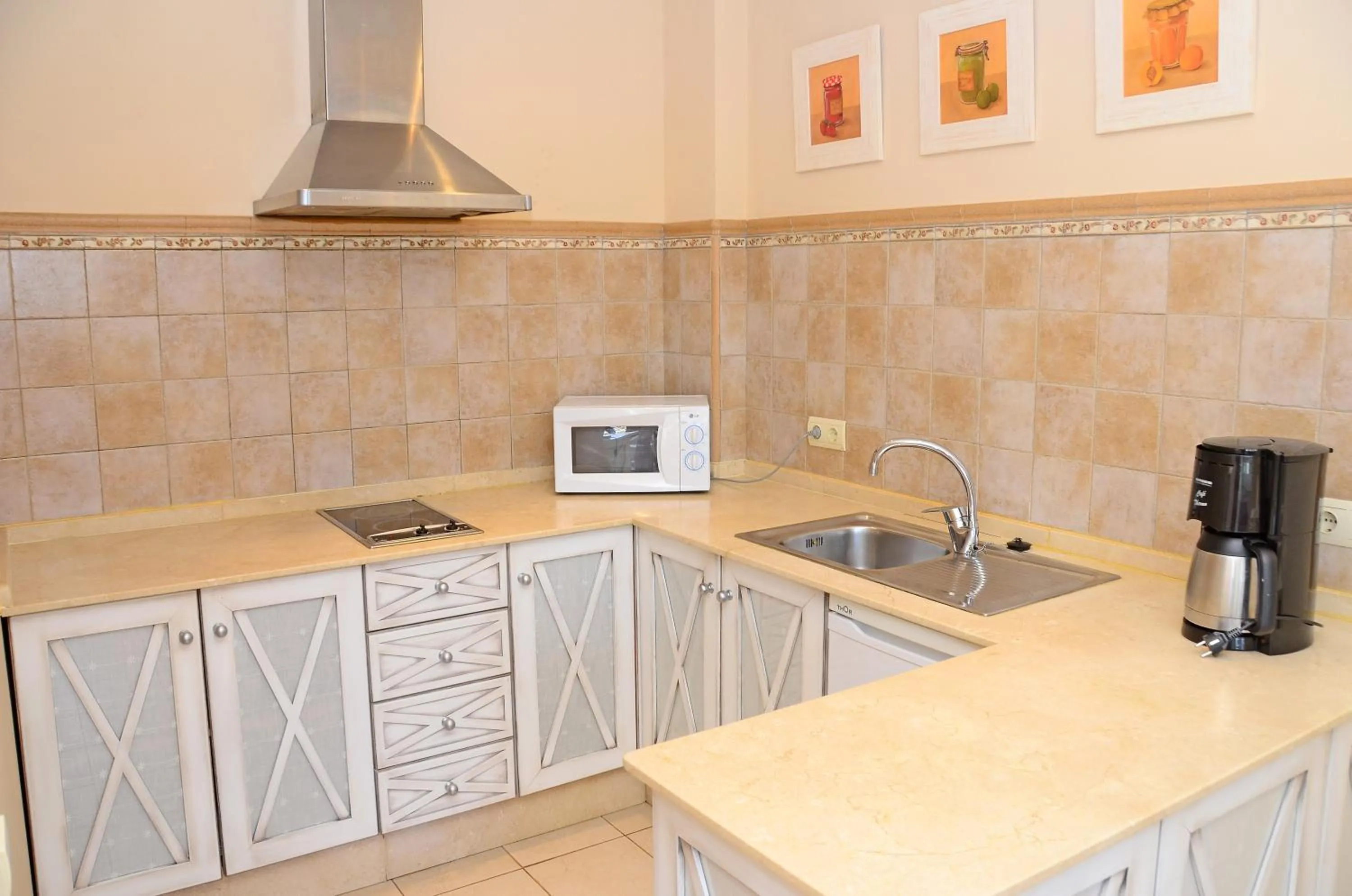 Kitchen or kitchenette in Apartamentos Piedramar