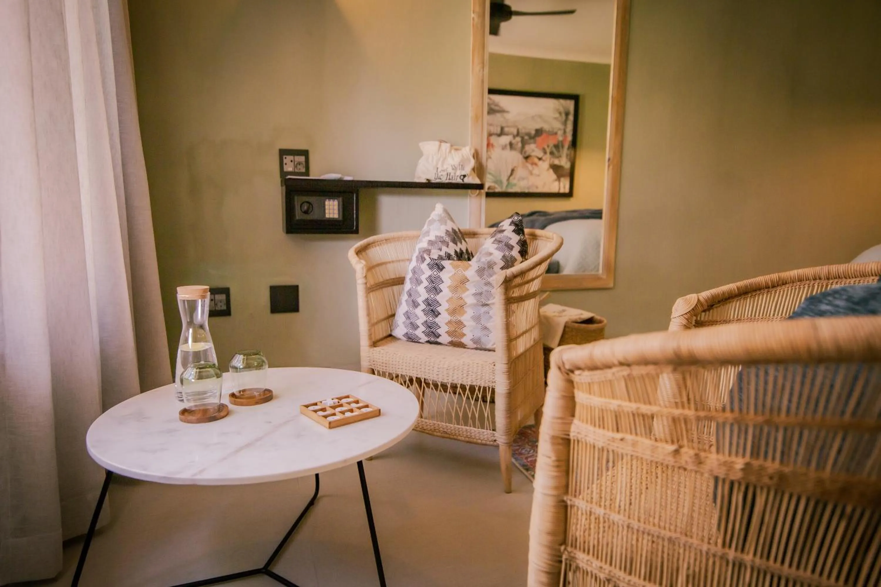 Seating area, Bed in Okapuka Safari Lodge