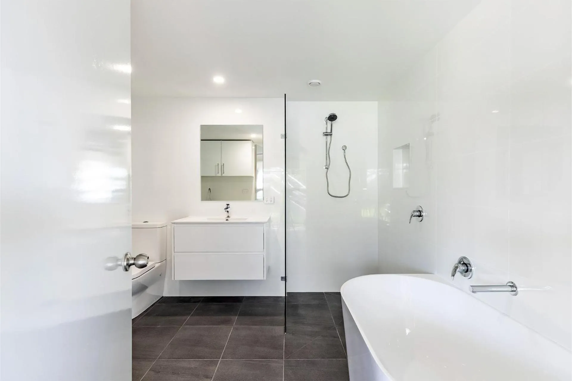 Shower in Five Pines Beach House at Birubi 20 Robinson St pet friendly aircon and WiFi