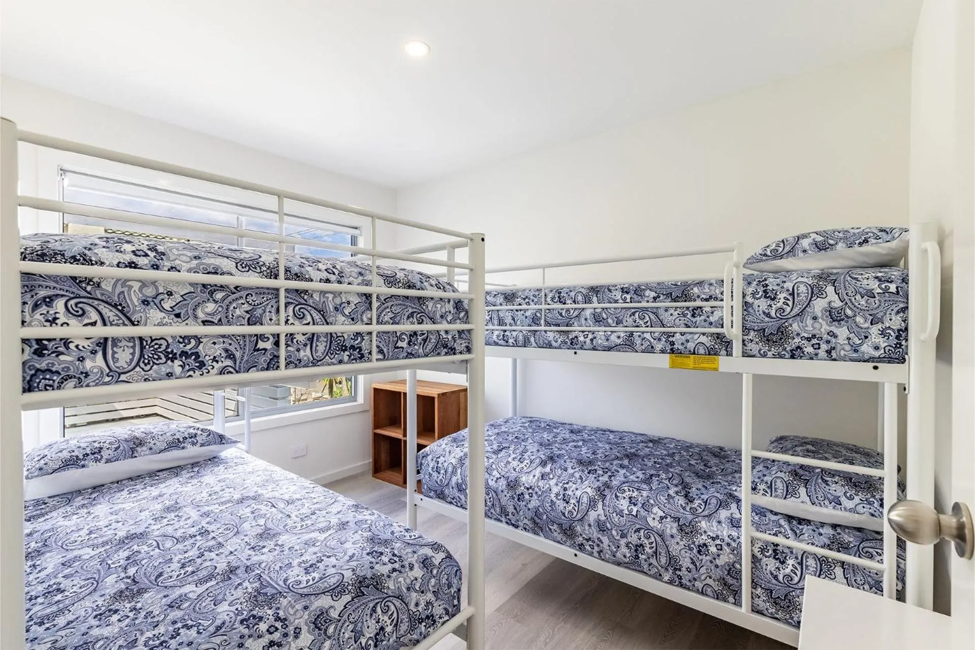 Bed in Five Pines Beach House at Birubi 20 Robinson St pet friendly aircon and WiFi