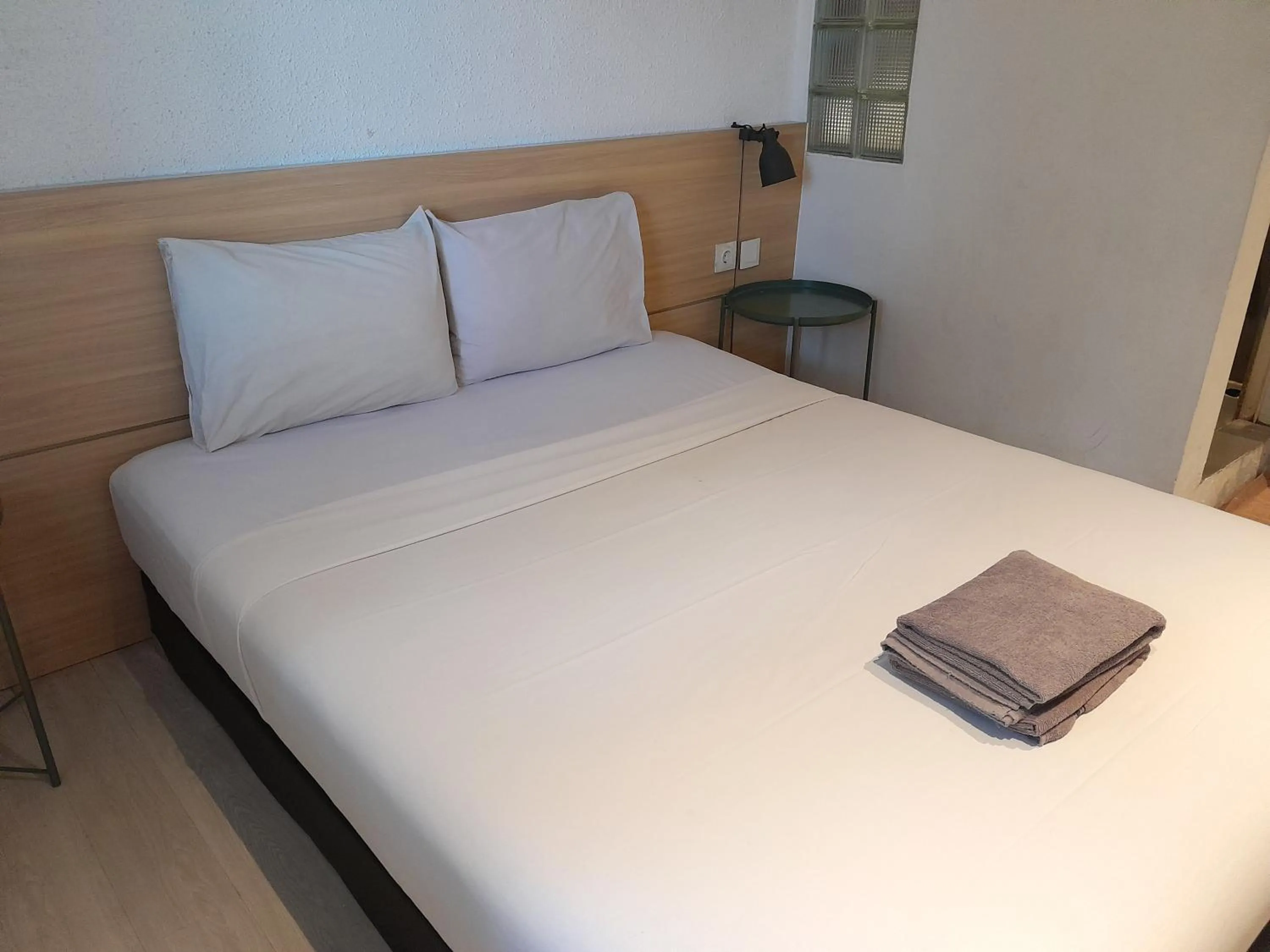 Bed in The Green Winotosastro Hotel Yogyakarta