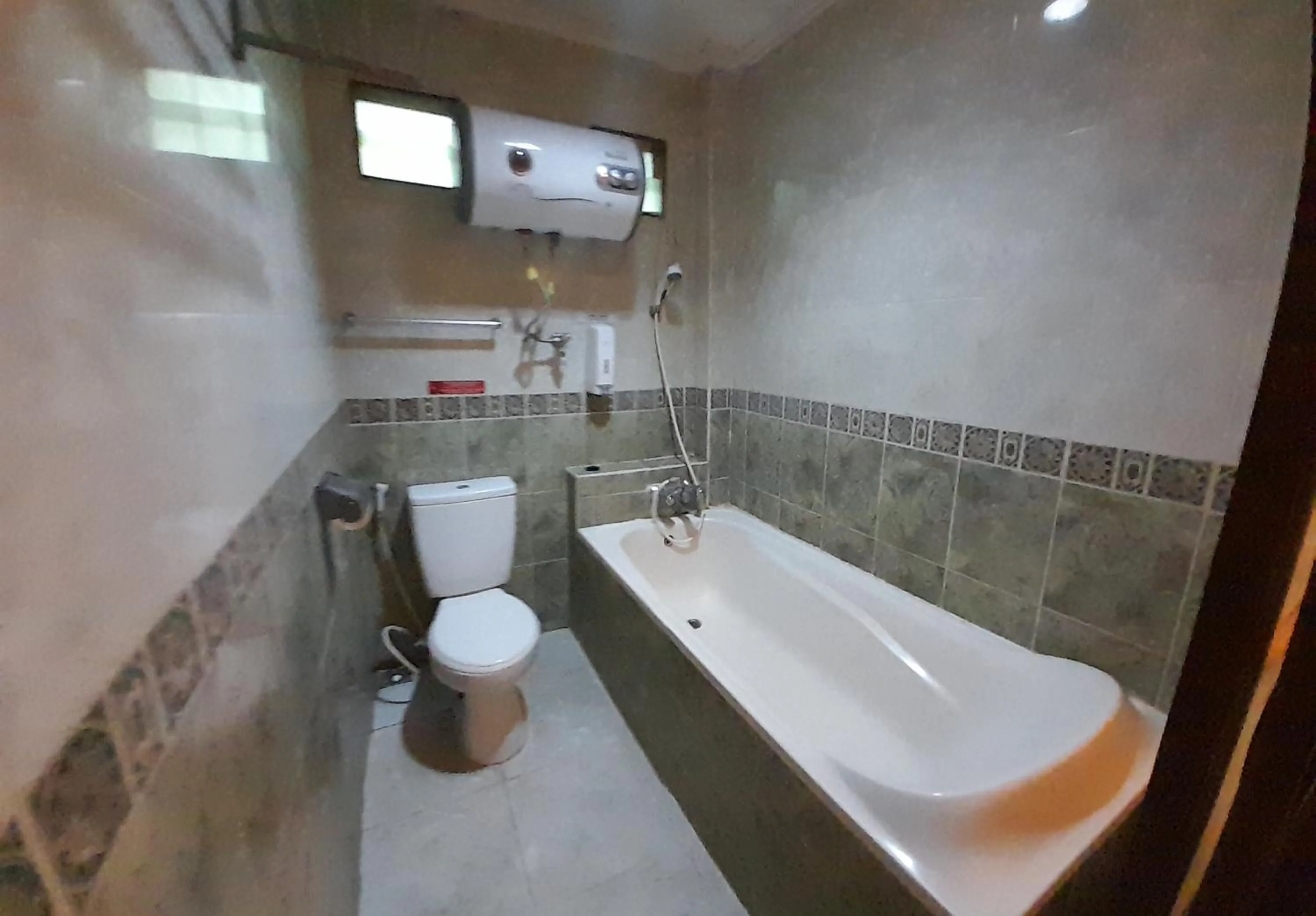 Bathroom in The Green Winotosastro Hotel Yogyakarta