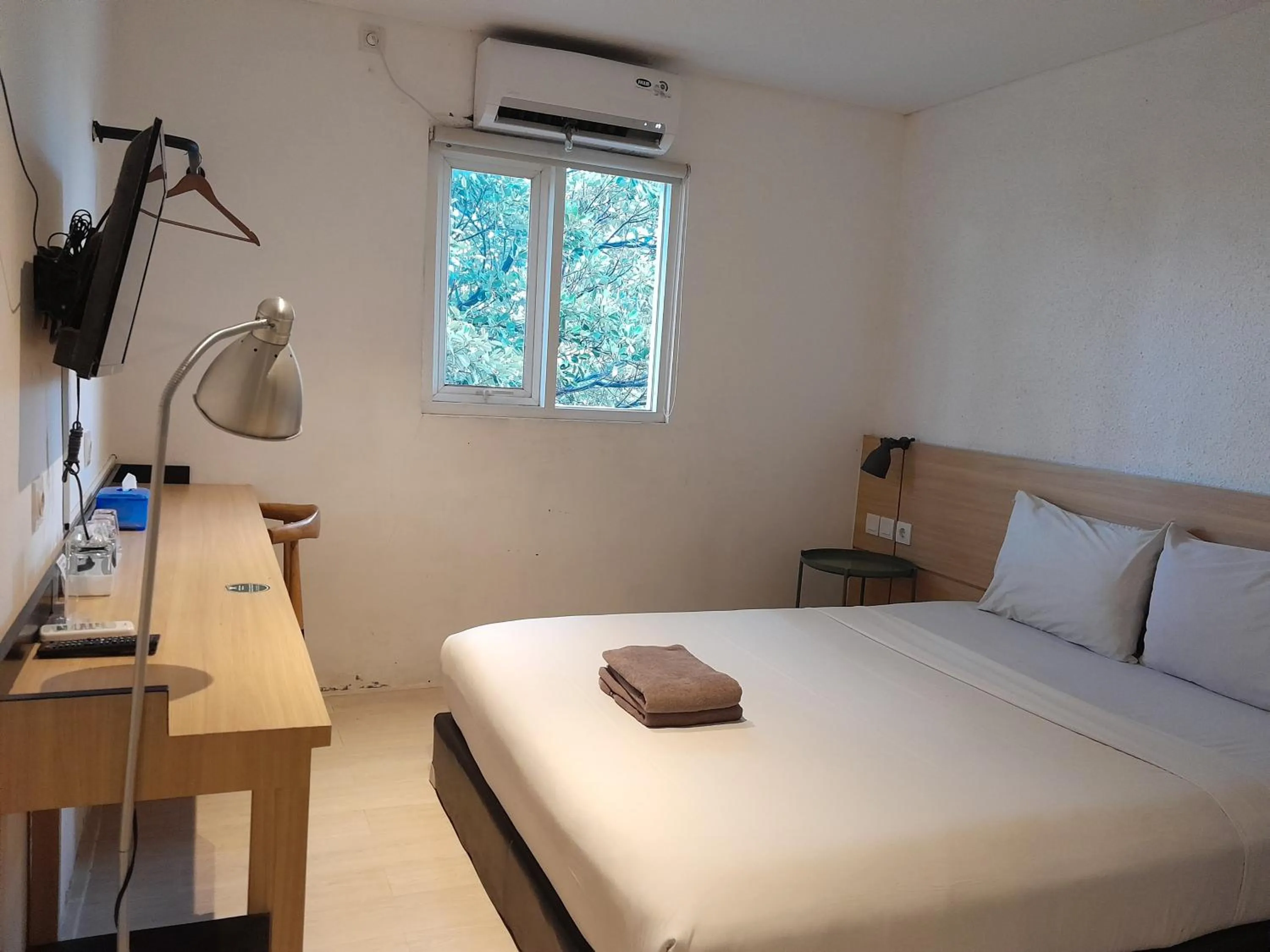 Bed in The Green Winotosastro Hotel Yogyakarta