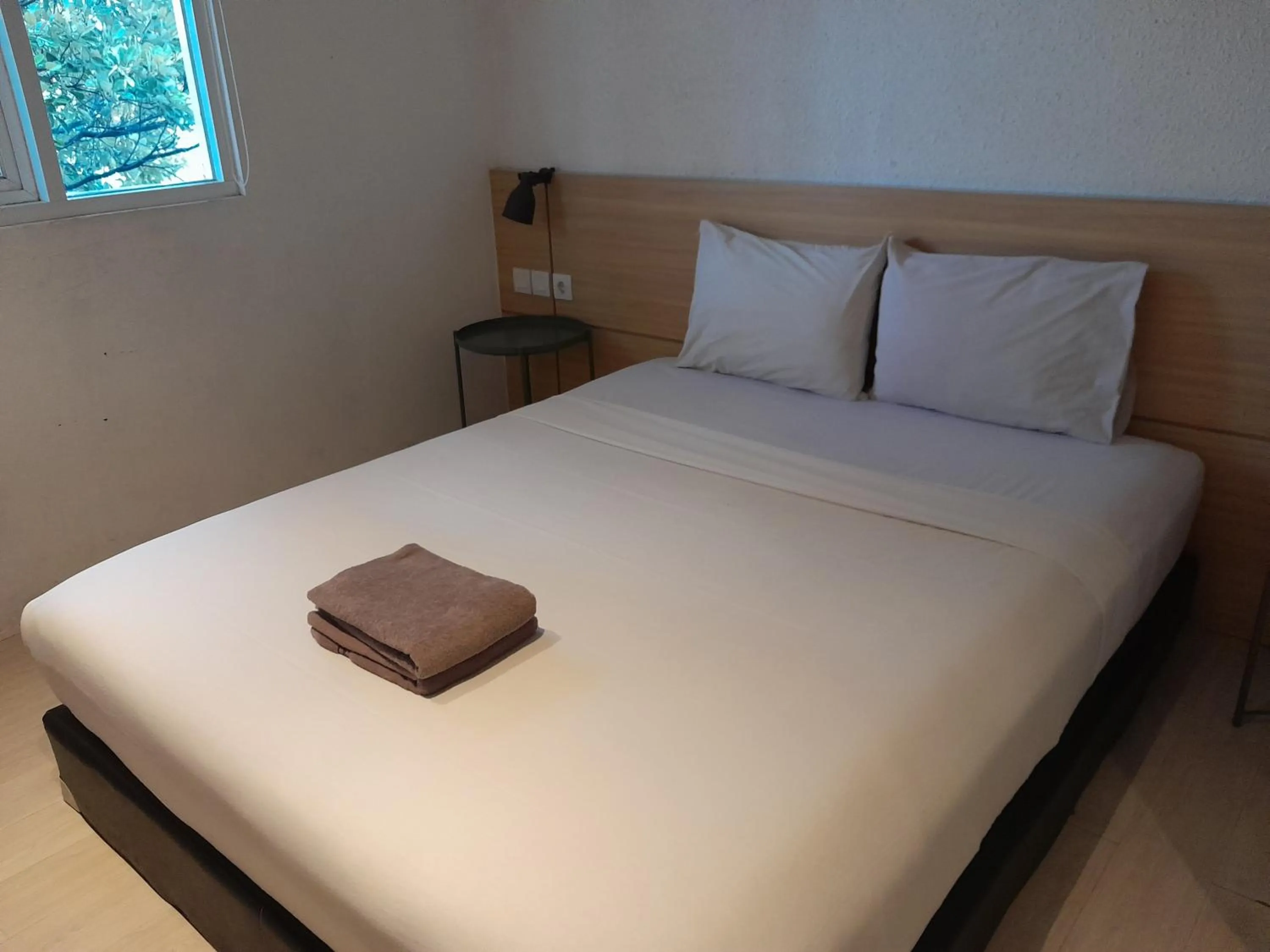 Bed in The Green Winotosastro Hotel Yogyakarta