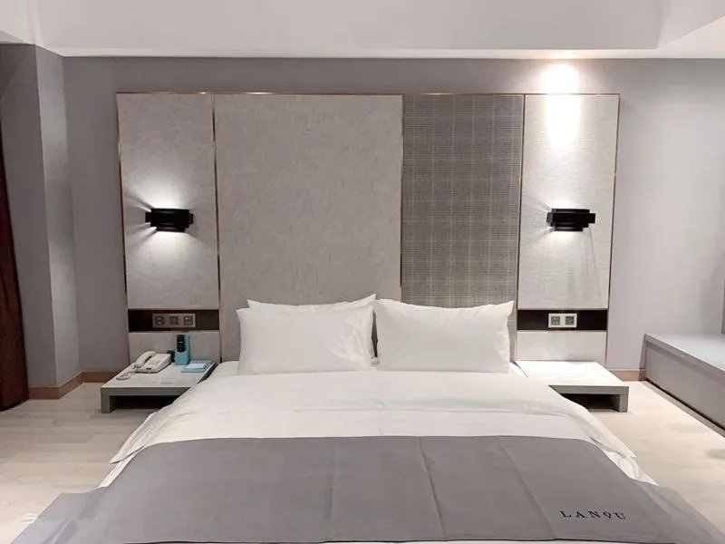 Bed in LanOu Hotel Yancheng Dafeng Yongtai Plaza