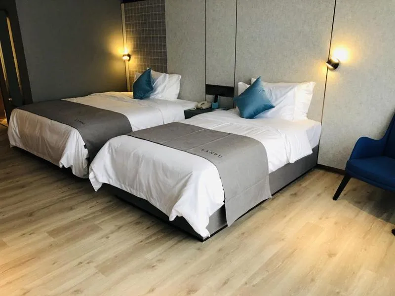 Bed in LanOu Hotel Zhenjiang Runzhou District Railway Station