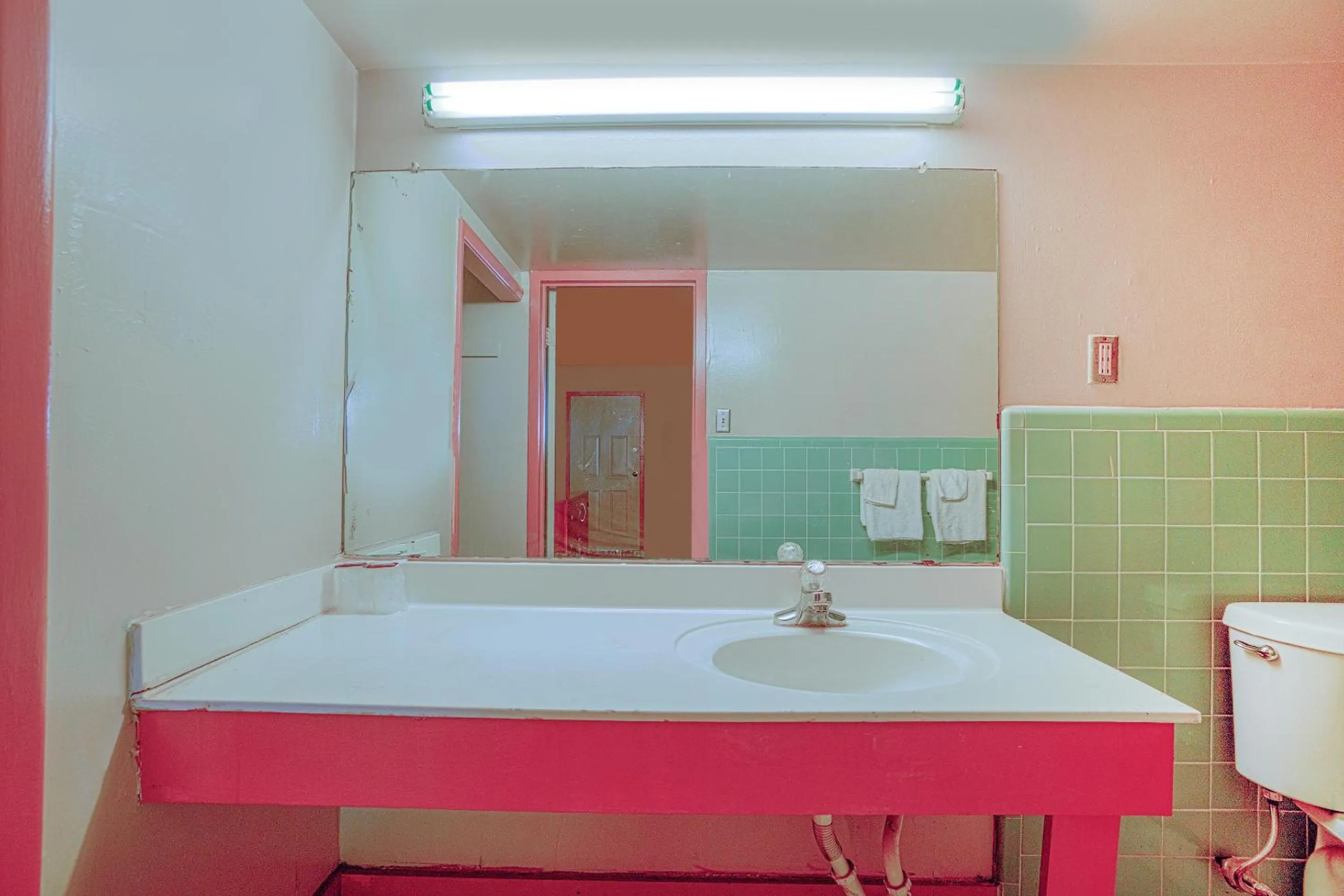 Bathroom in Town & Country Motel Bossier City by OYO