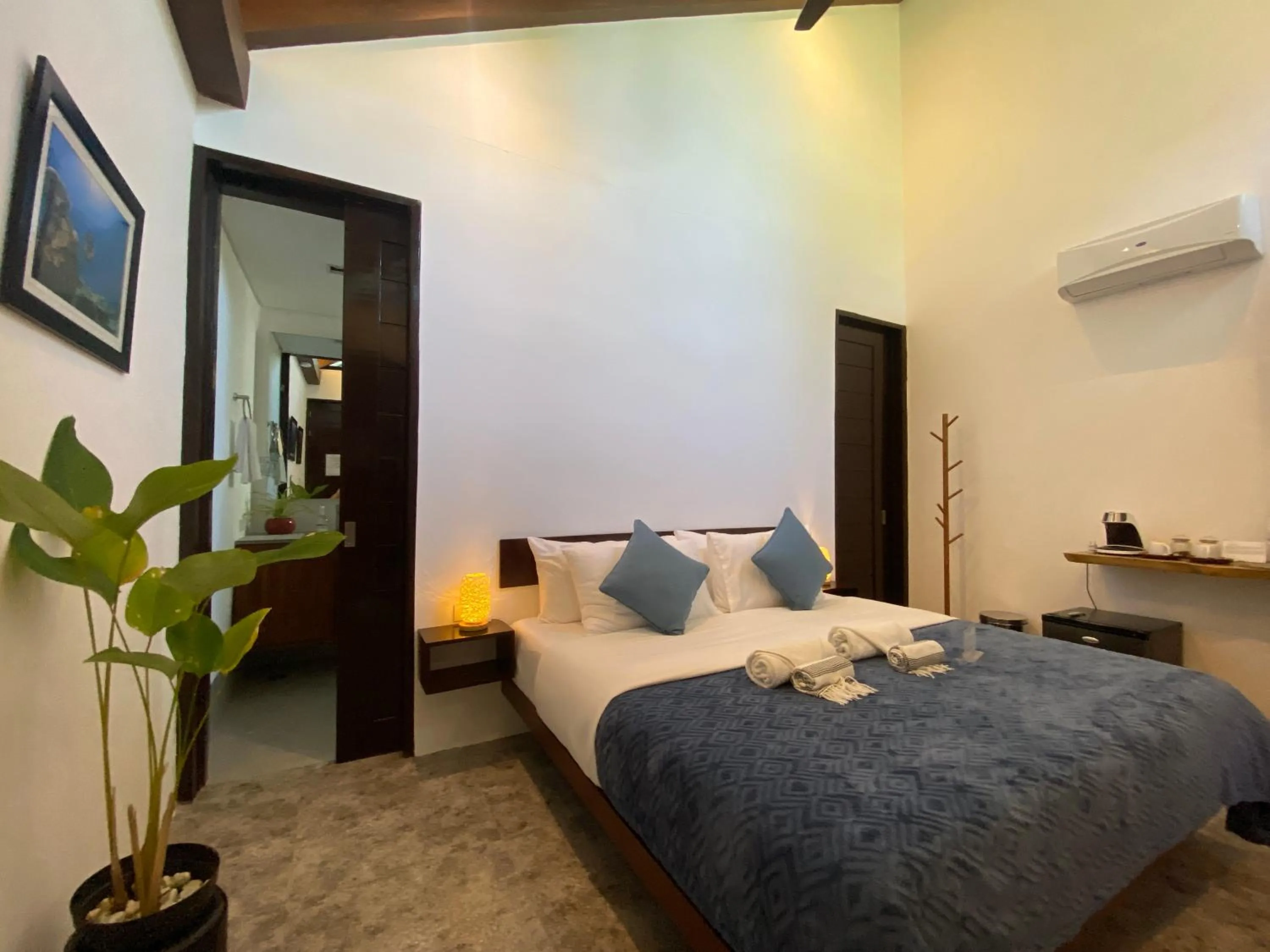 Bed in Amila Dive Beach Resort