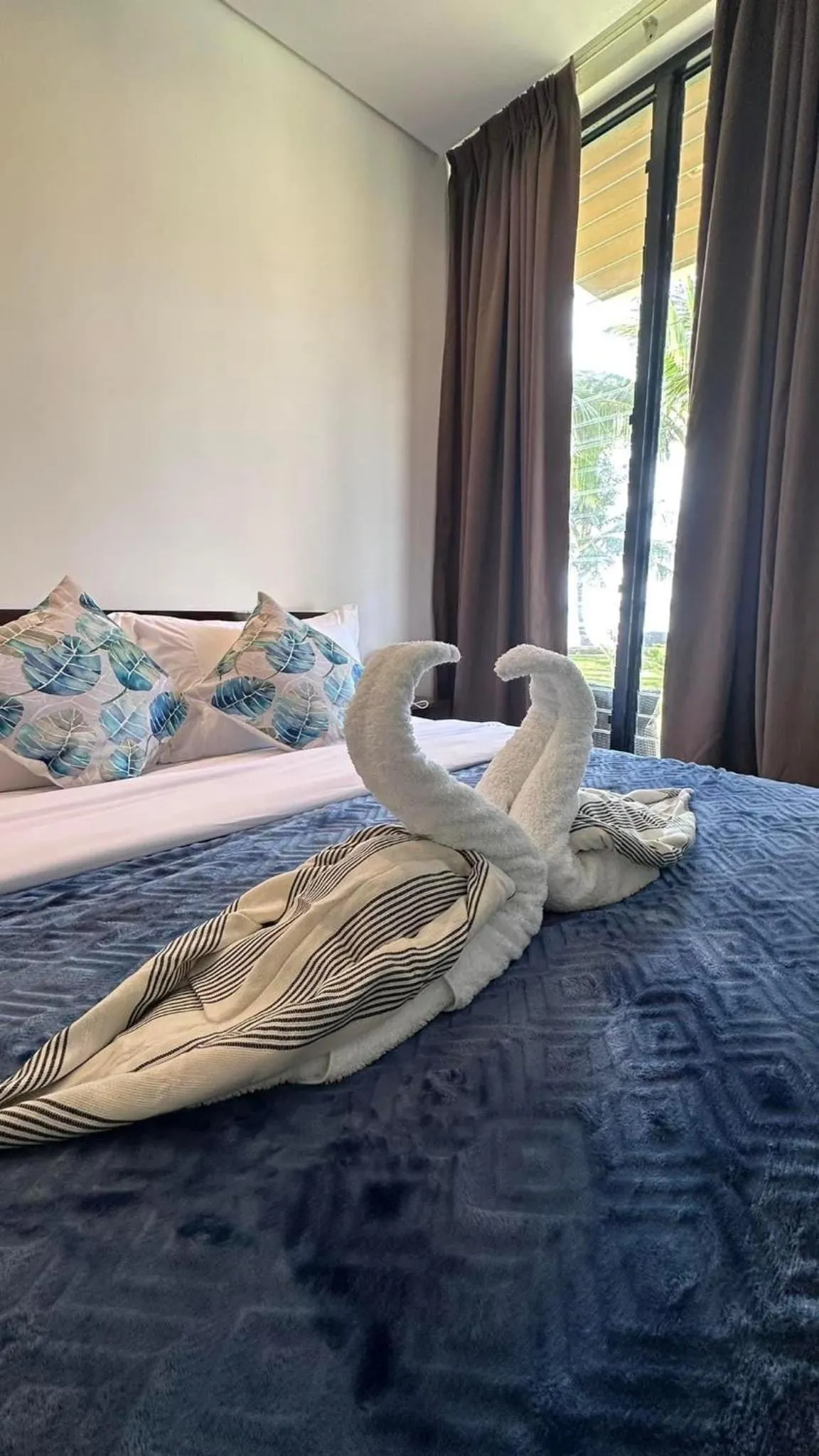 Bed in Amila Dive Beach Resort