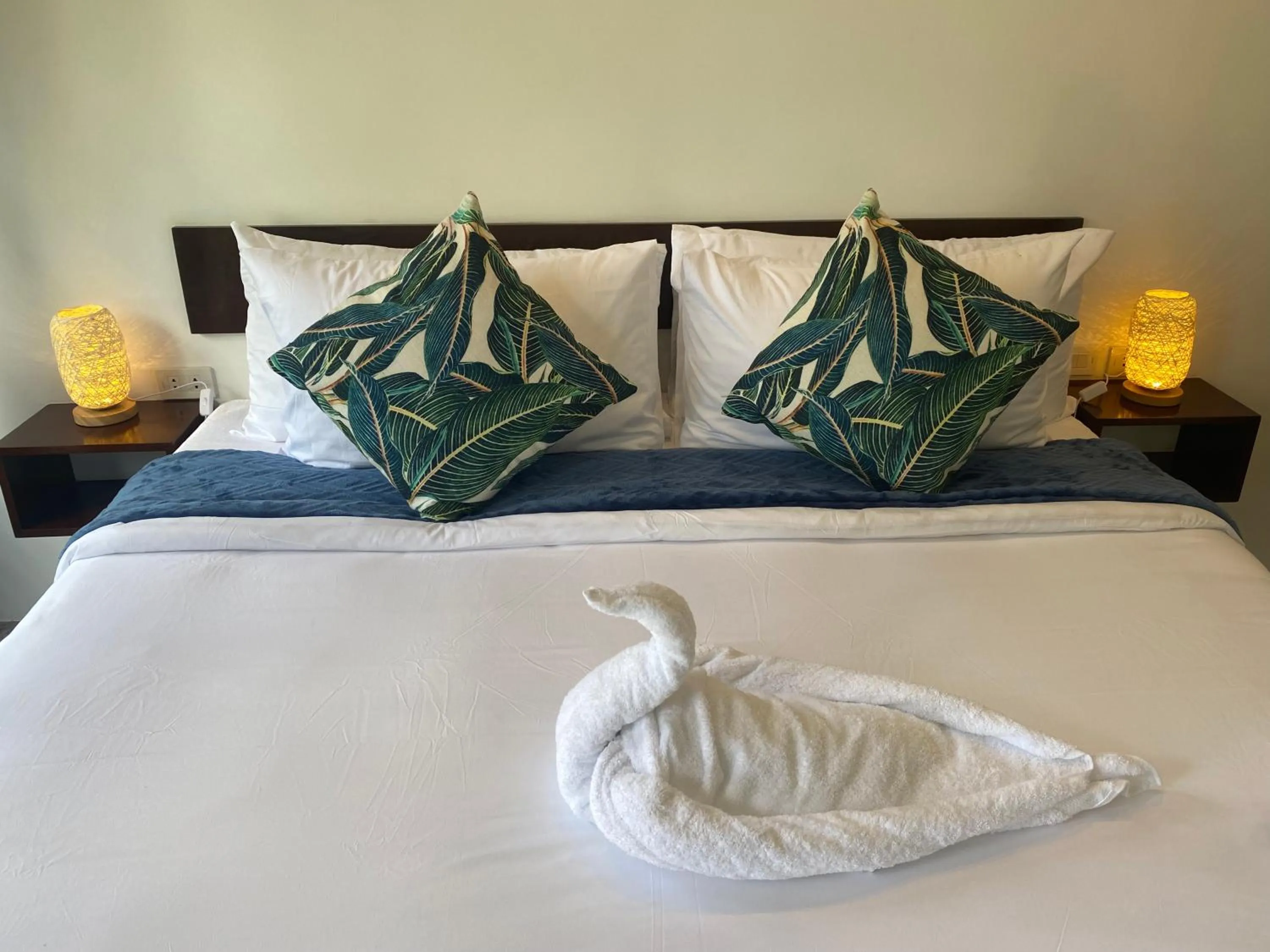 Bed in Amila Dive Beach Resort