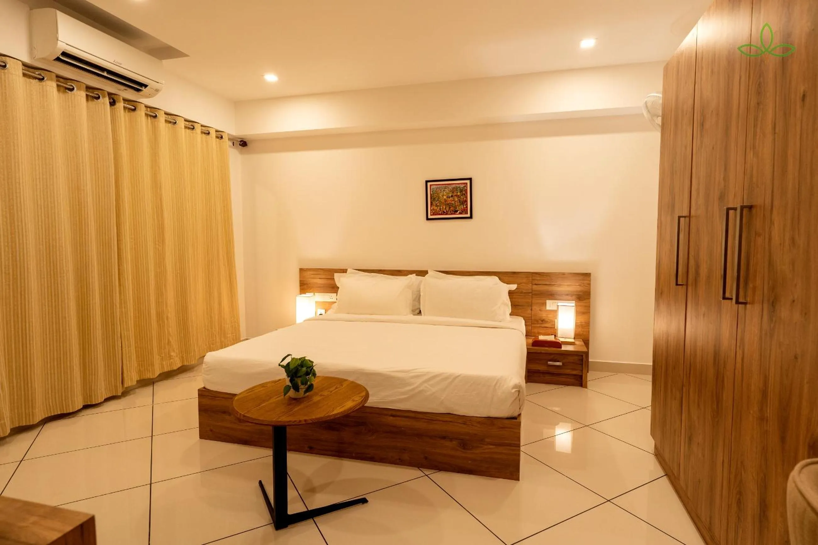 Photo of the whole room, Bed in Tea Tree Suites,Manipal