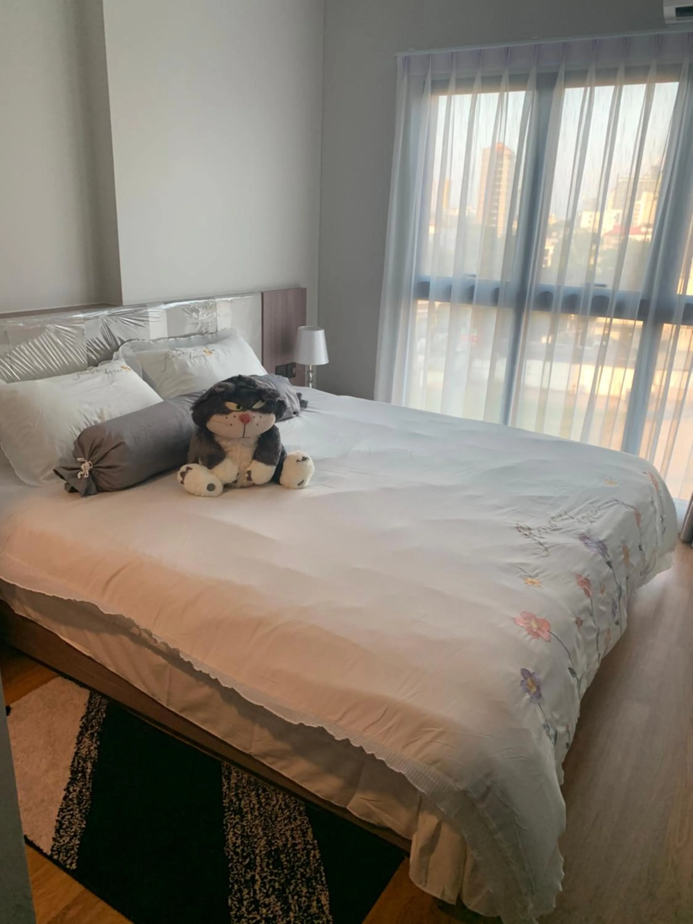 Bed in Astra Sky River Condo