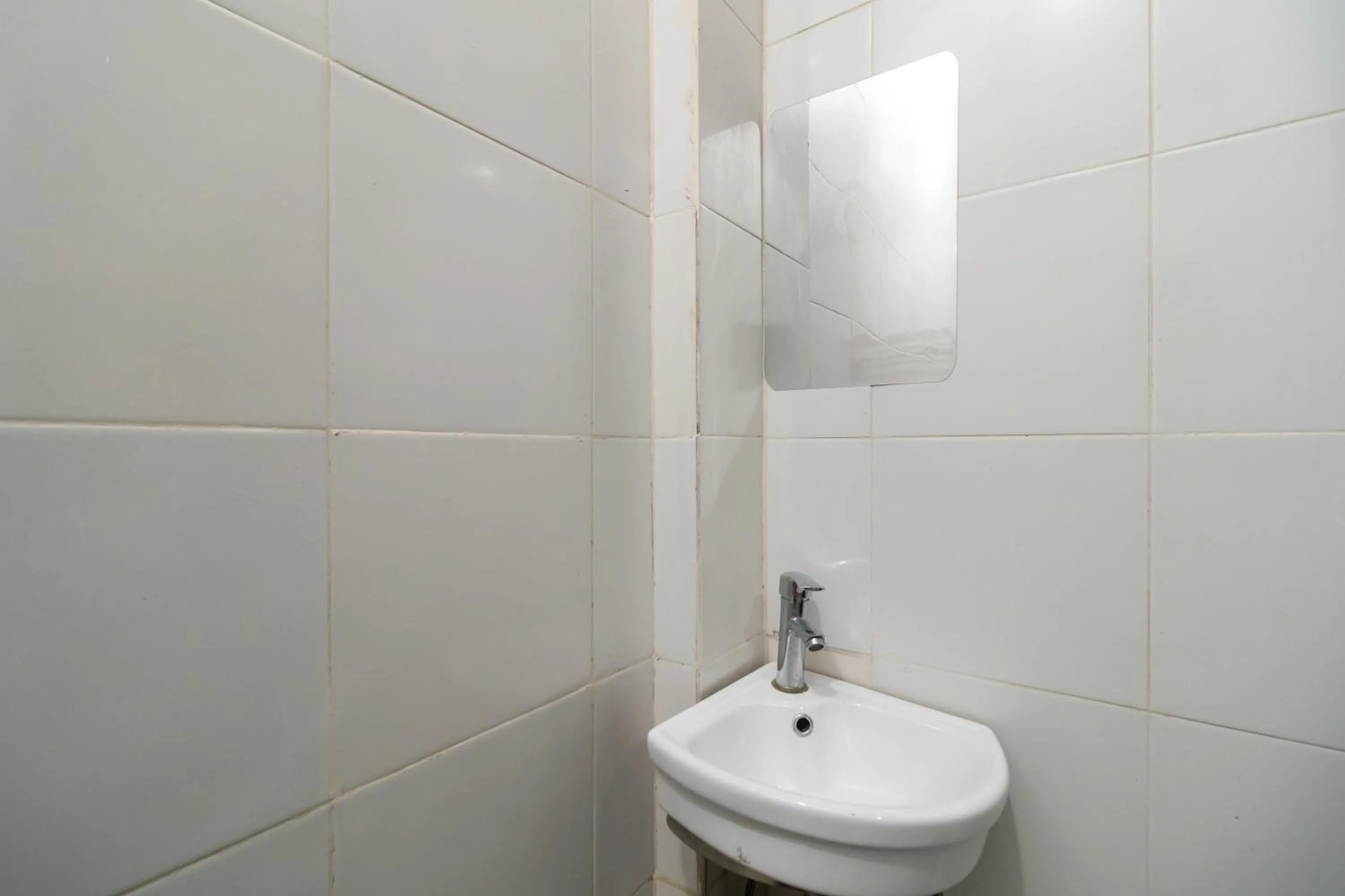 Bathroom in Urbanview Hotel Bizhome Artha Gading Boulevard by RedDoorz