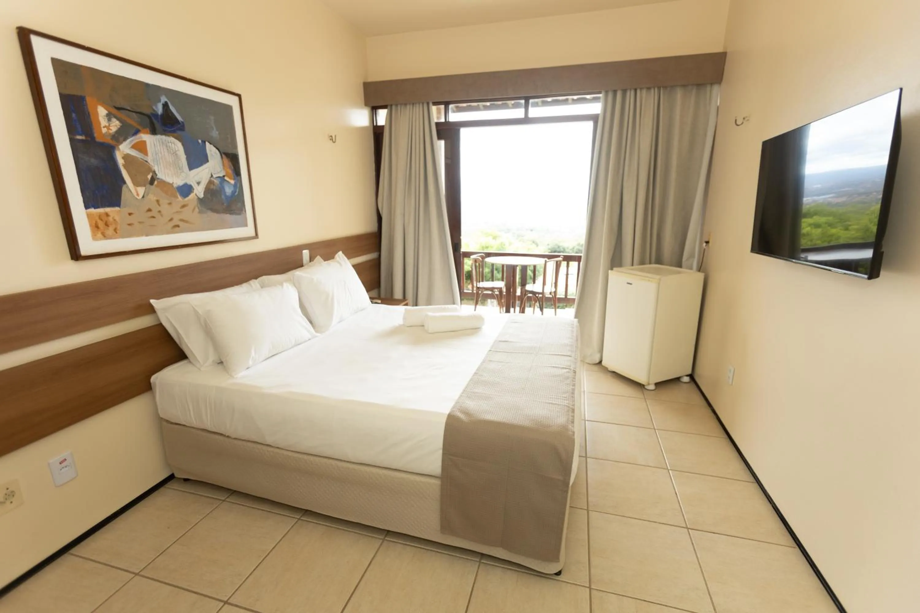 Communal lounge/ TV room, Bed in Pasargada Hotel