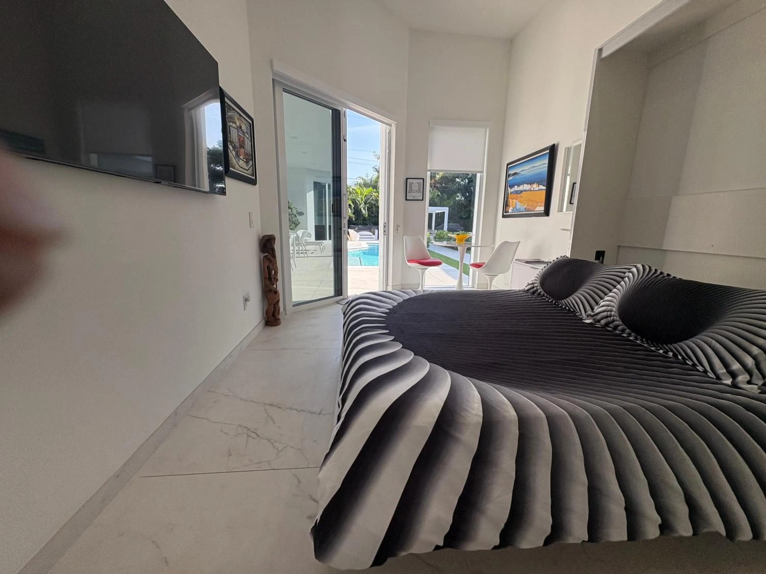 Bed in Men only clothing option guesthouse near Wilton Manors