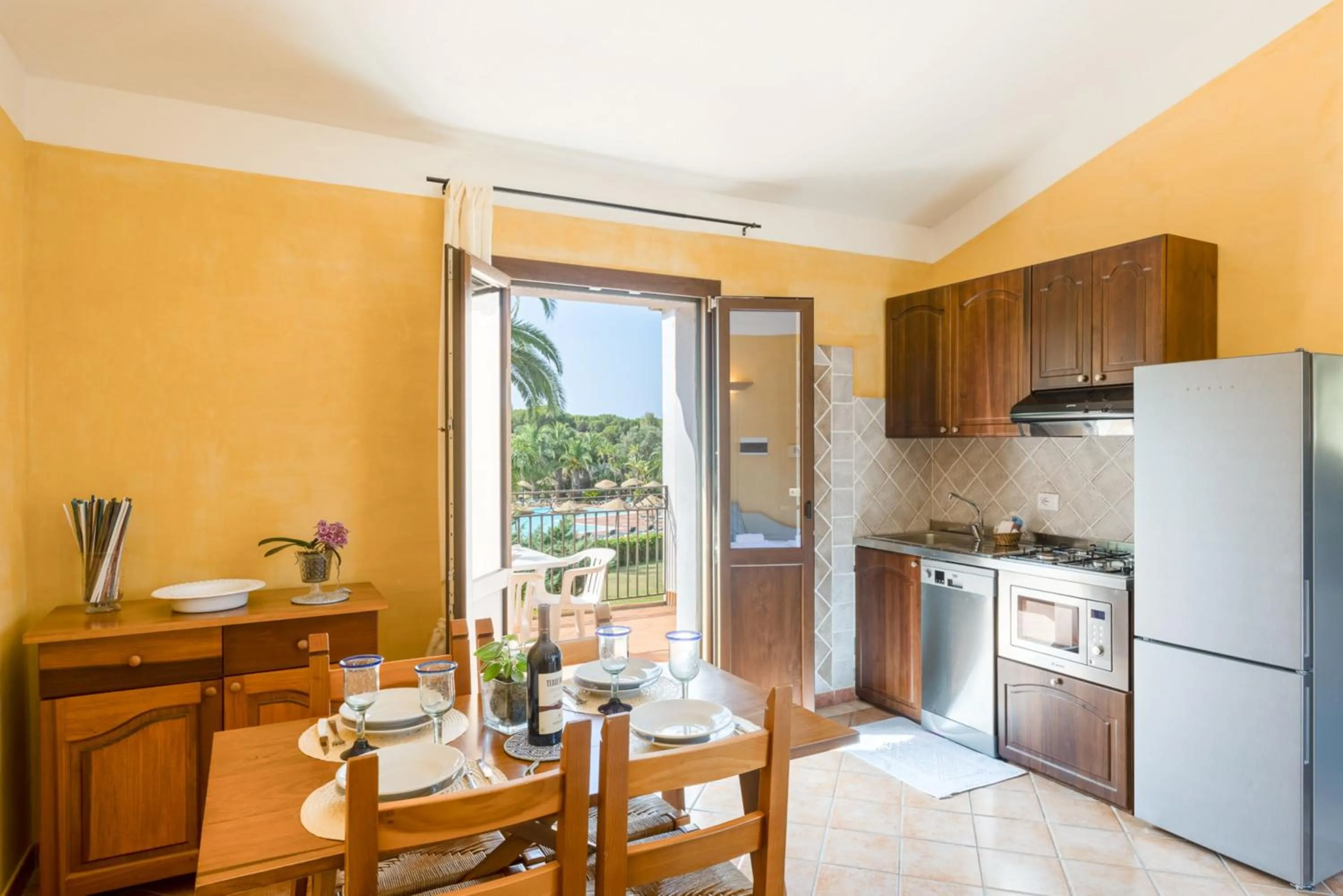 Kitchen or kitchenette in Baia delle Palme residence
