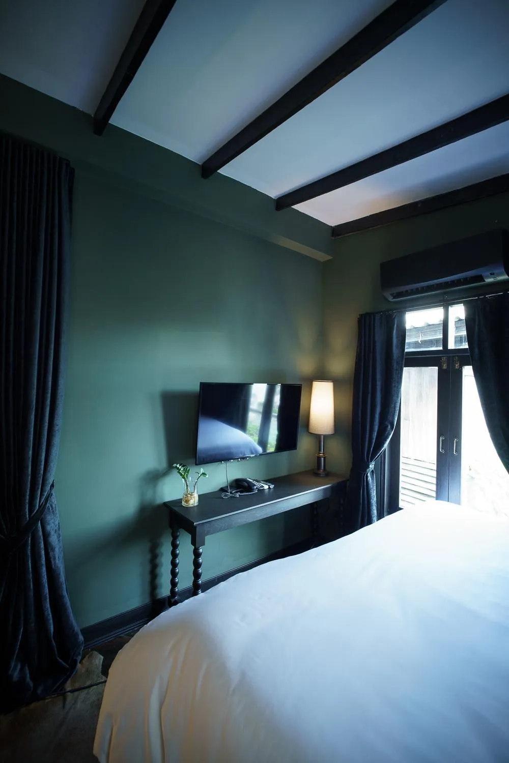 Bed in Baan Tuk Din Hotel