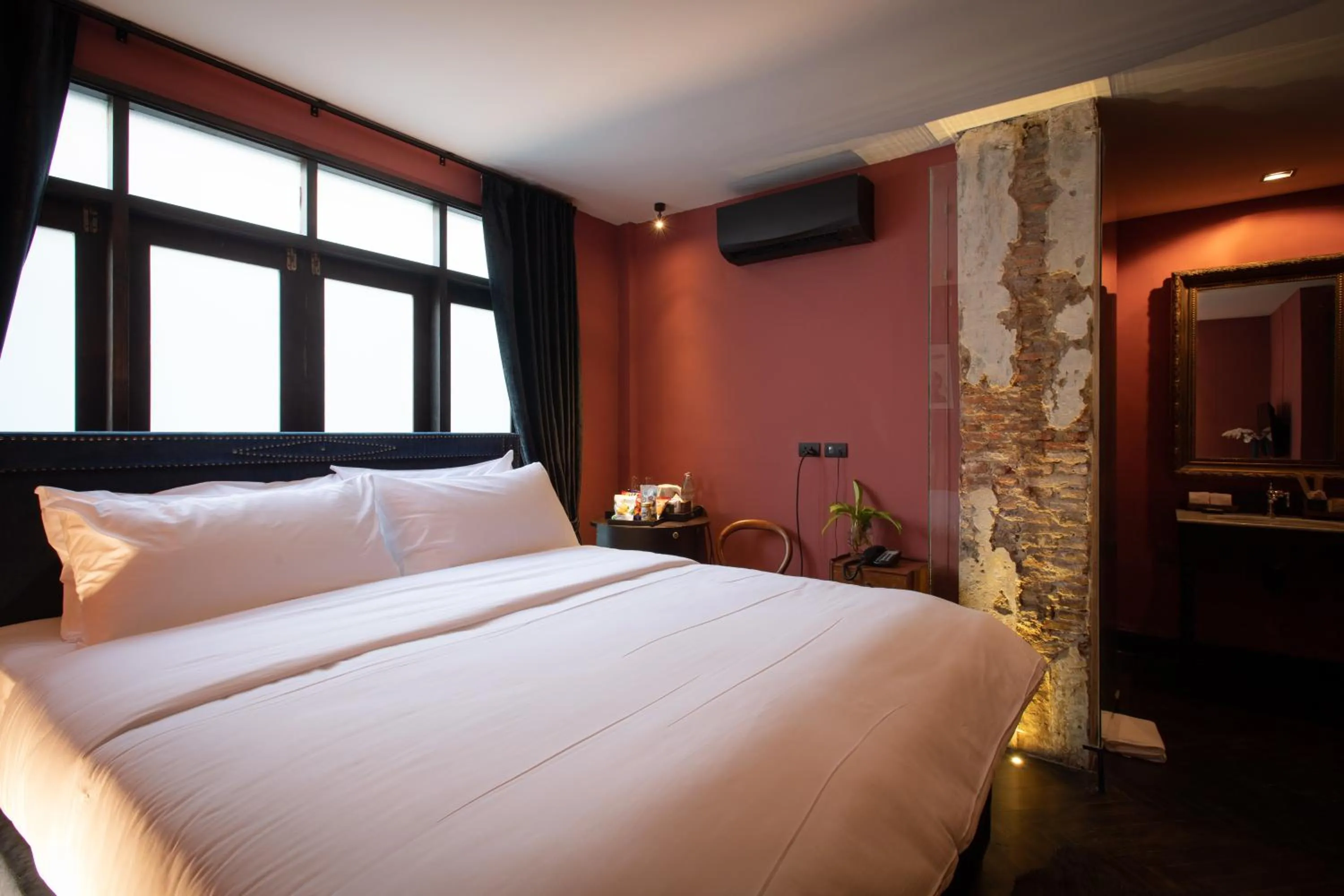 Bed in Baan Tuk Din Hotel