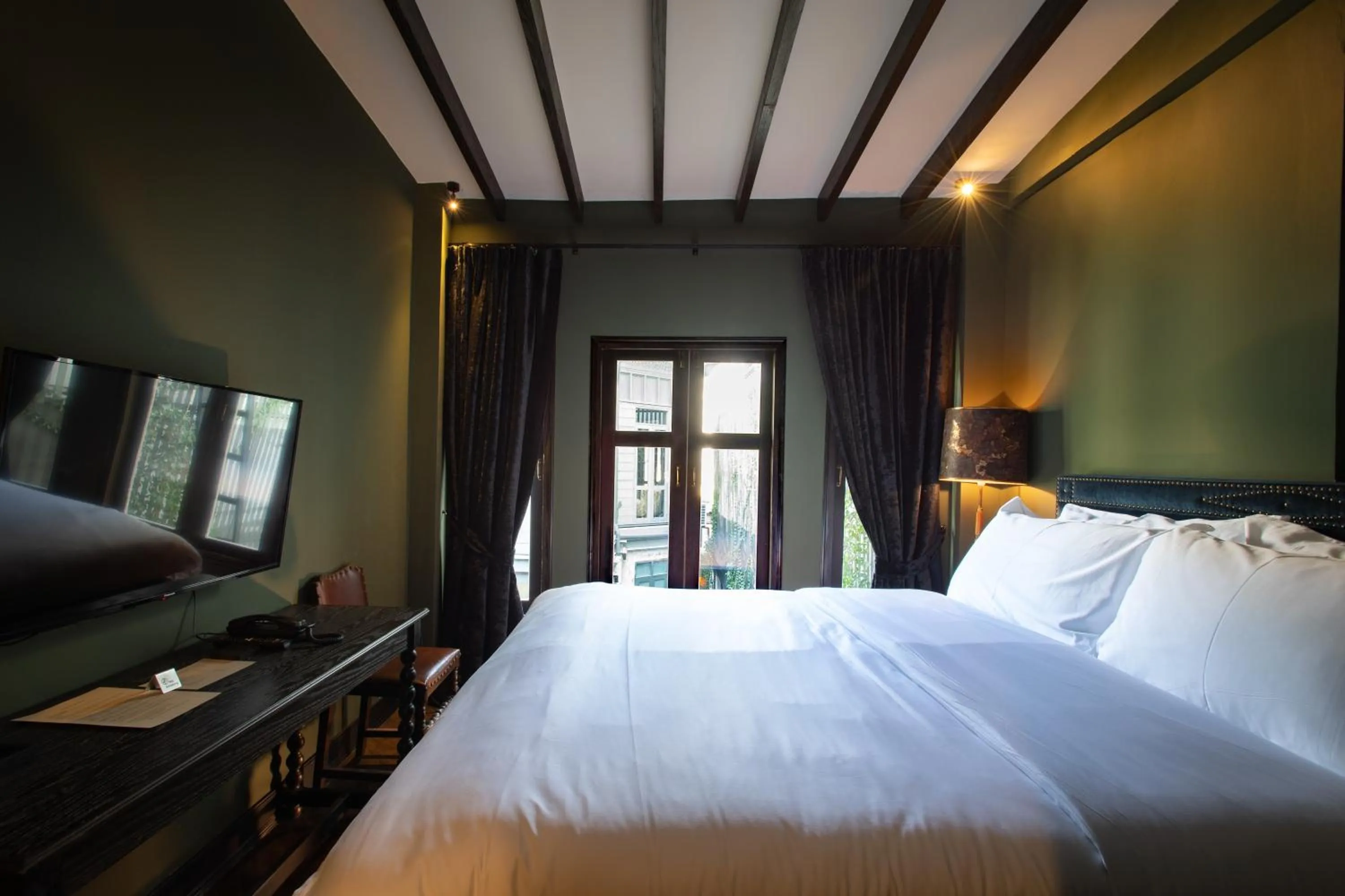 Bed in Baan Tuk Din Hotel