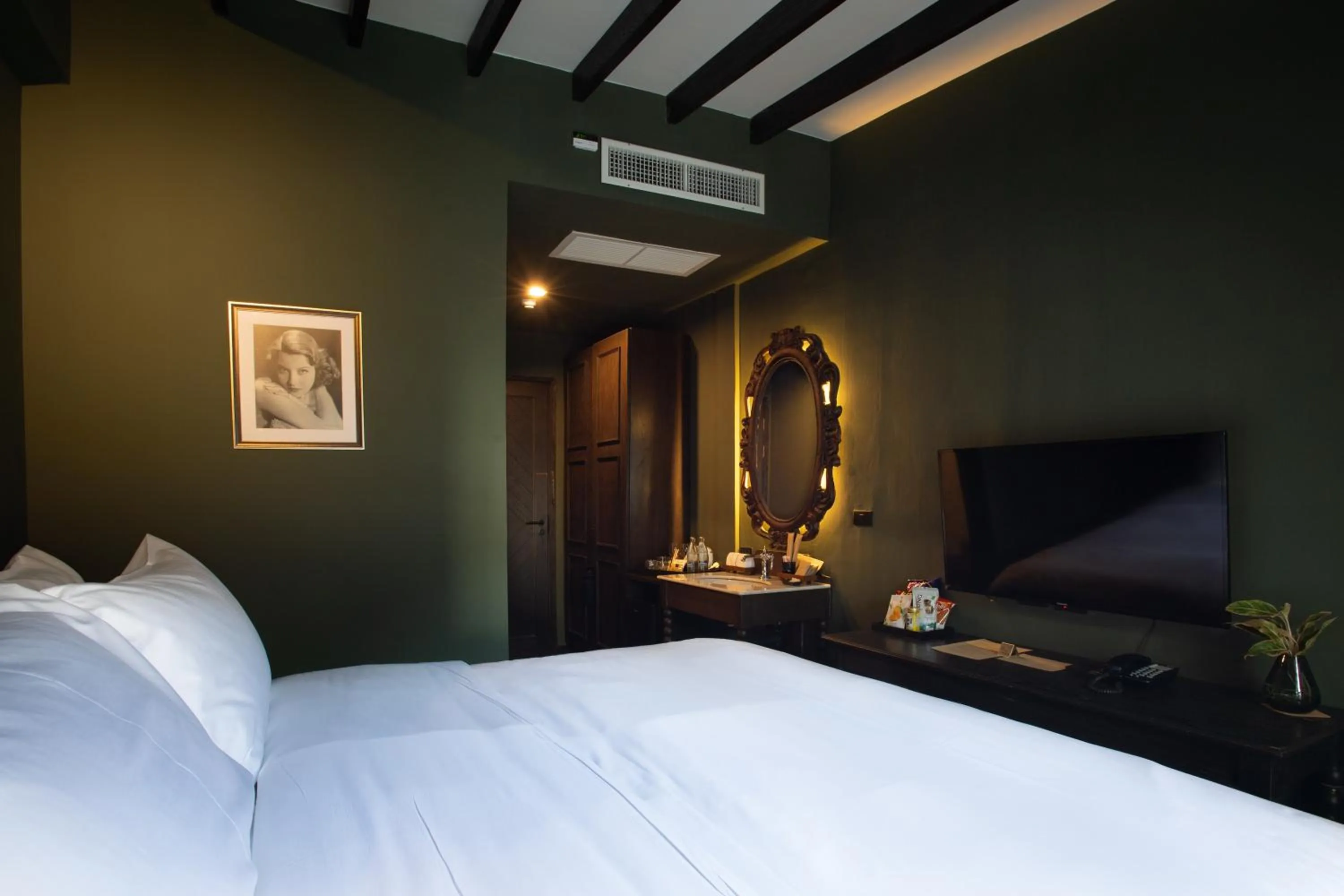 Bed in Baan Tuk Din Hotel