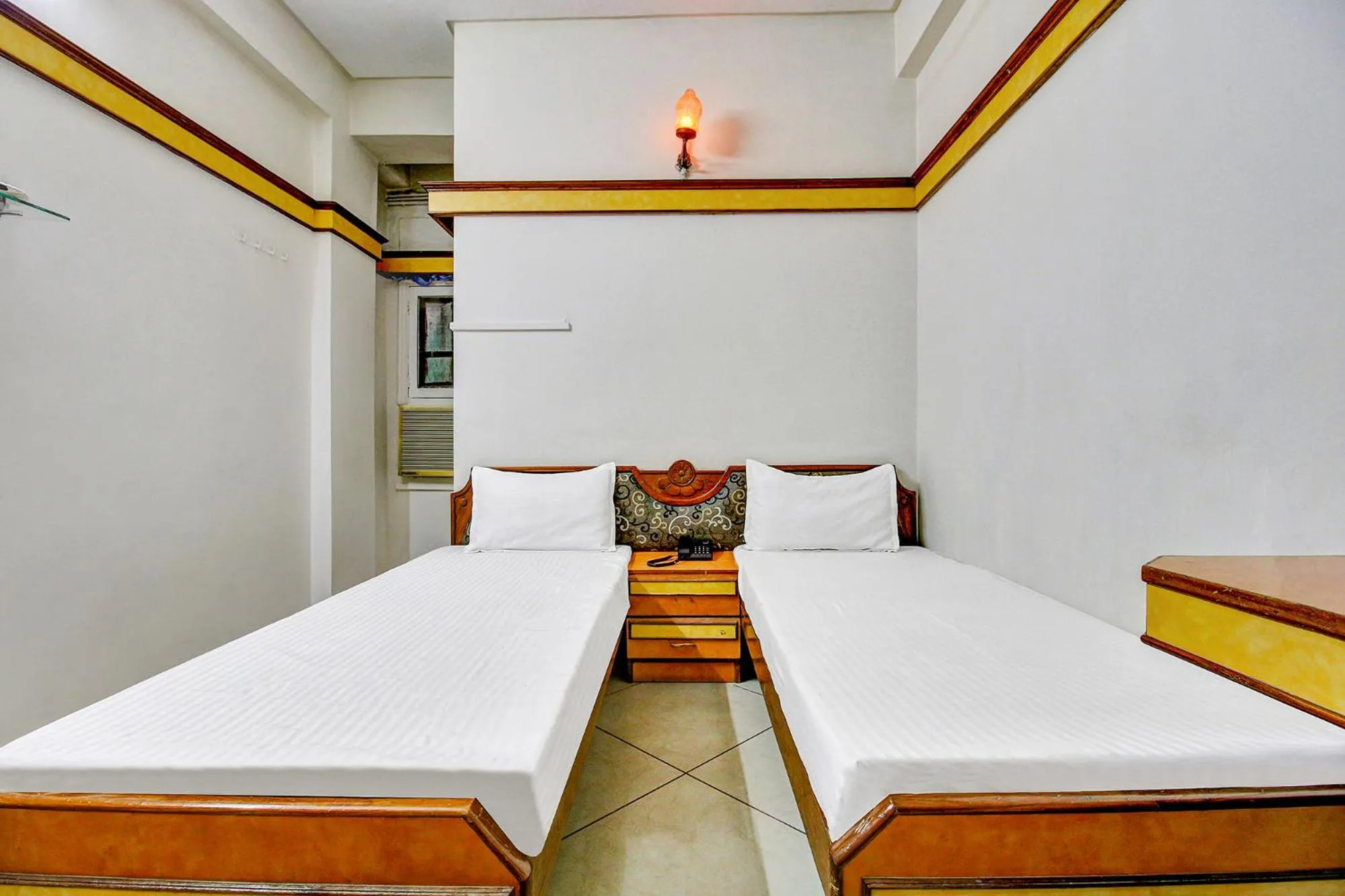 Bed in FabHotel Prime Manjeet