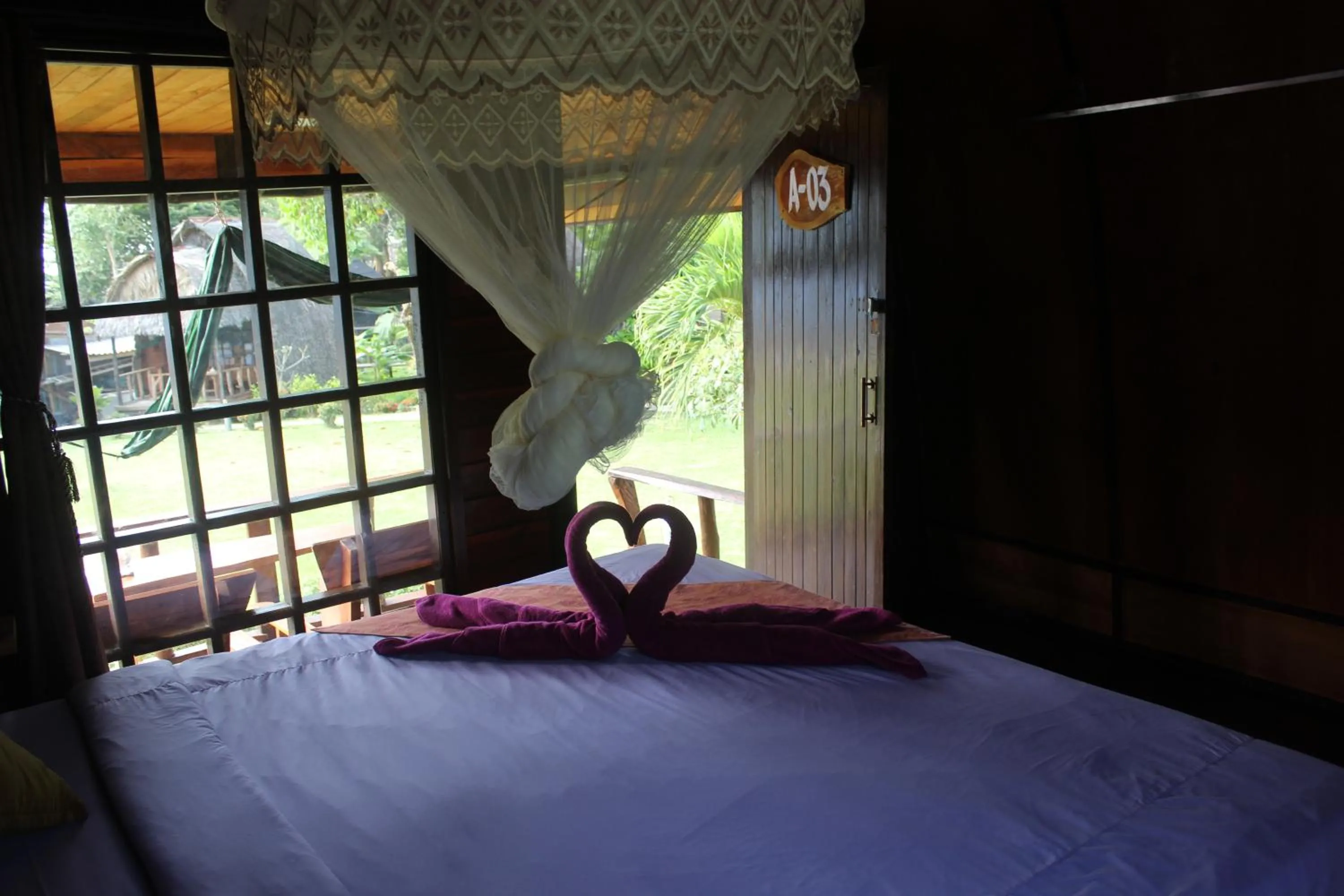 Bed in Eden Lanta Bungalow