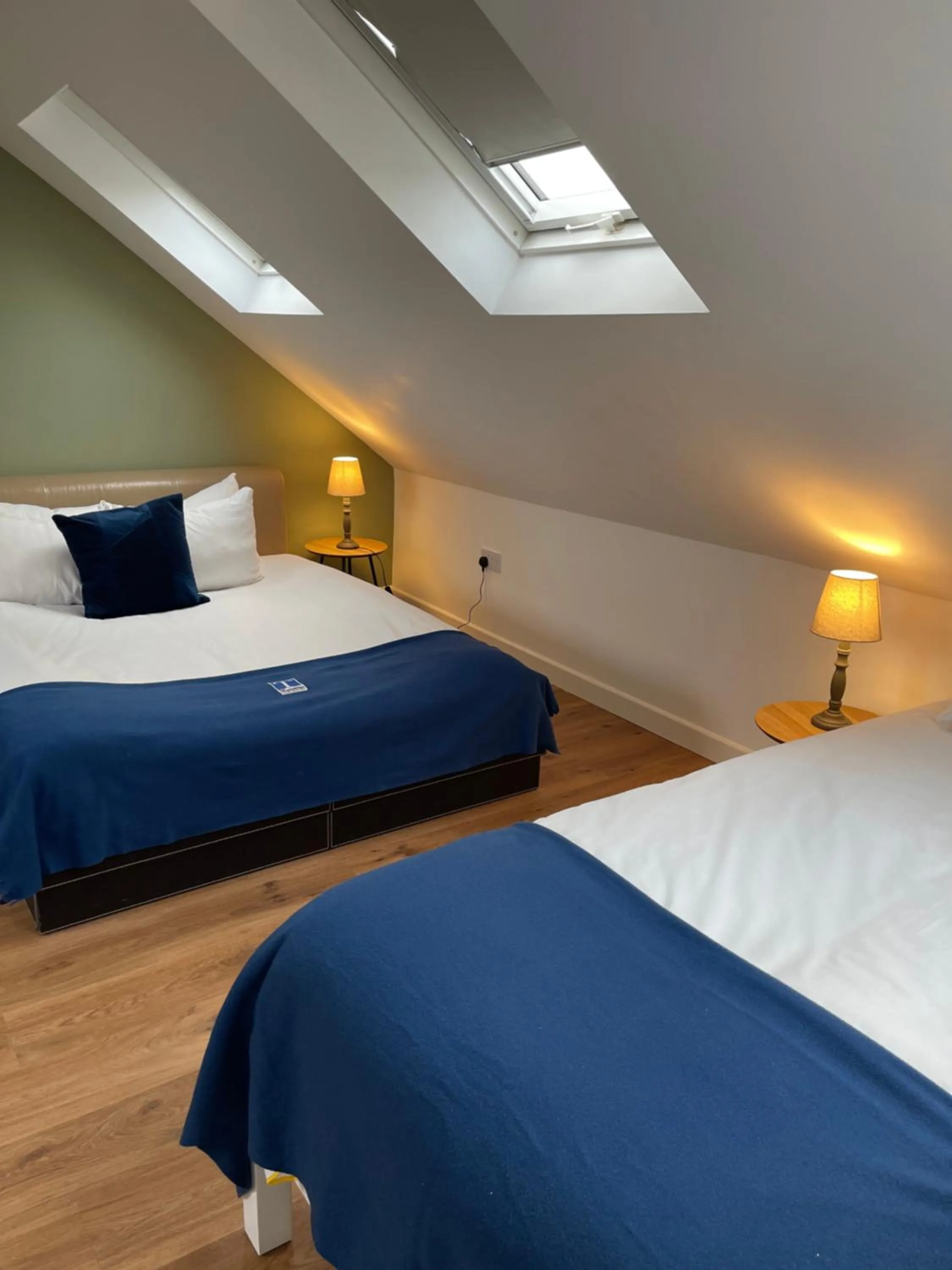 Bed in Cambridge Studios and Suites by Tas Accommodations