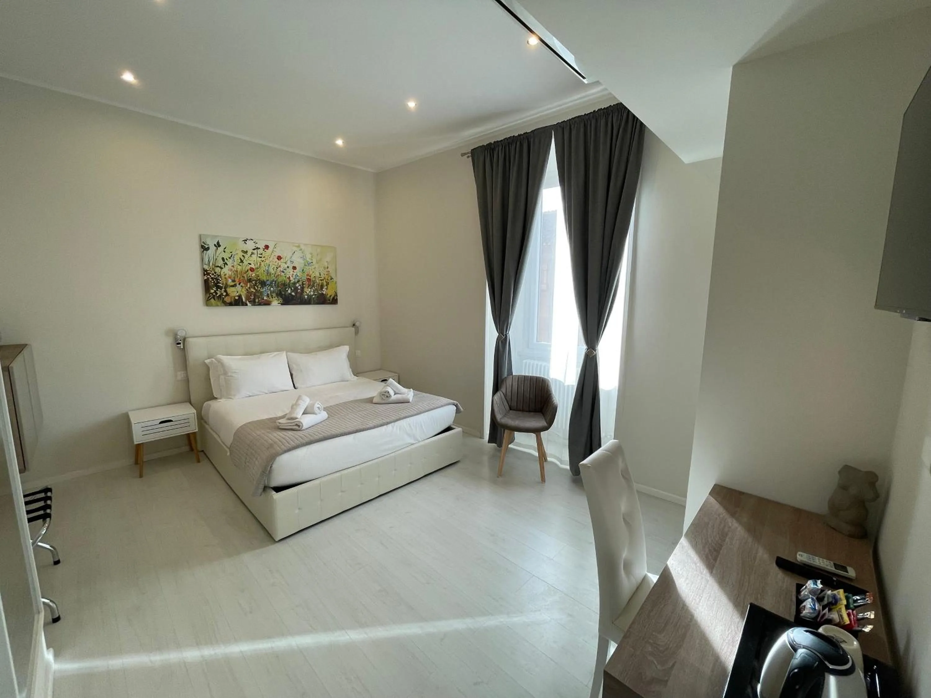 Bed in Quintus Luxury Suites