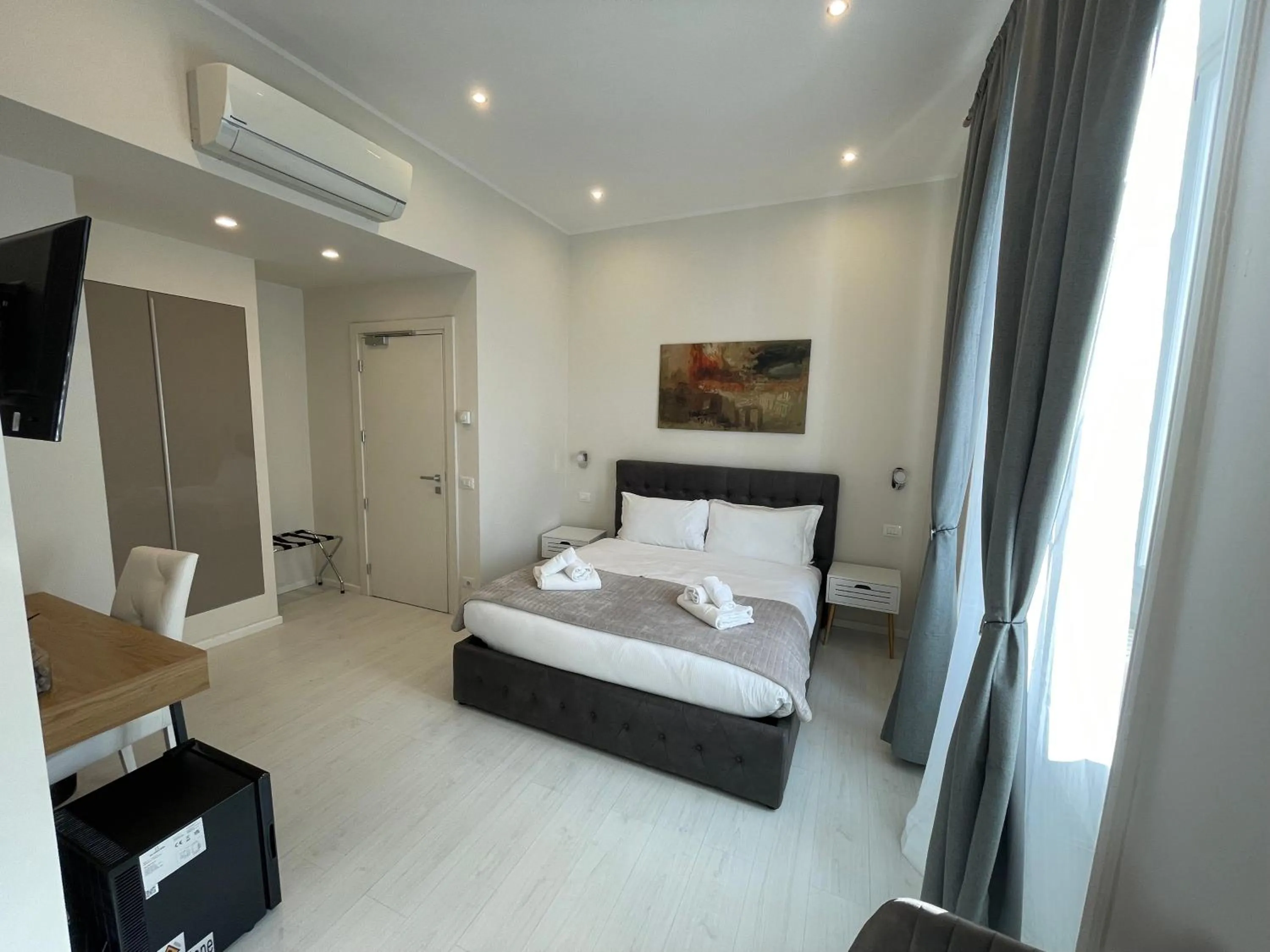 Bed in Quintus Luxury Suites