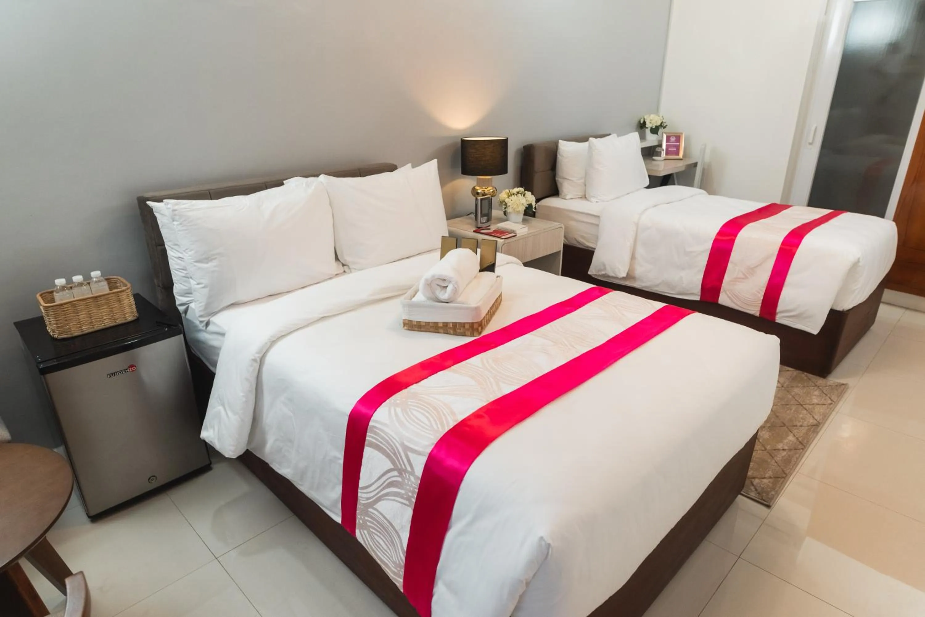 Bed in Monica Midtown Suites