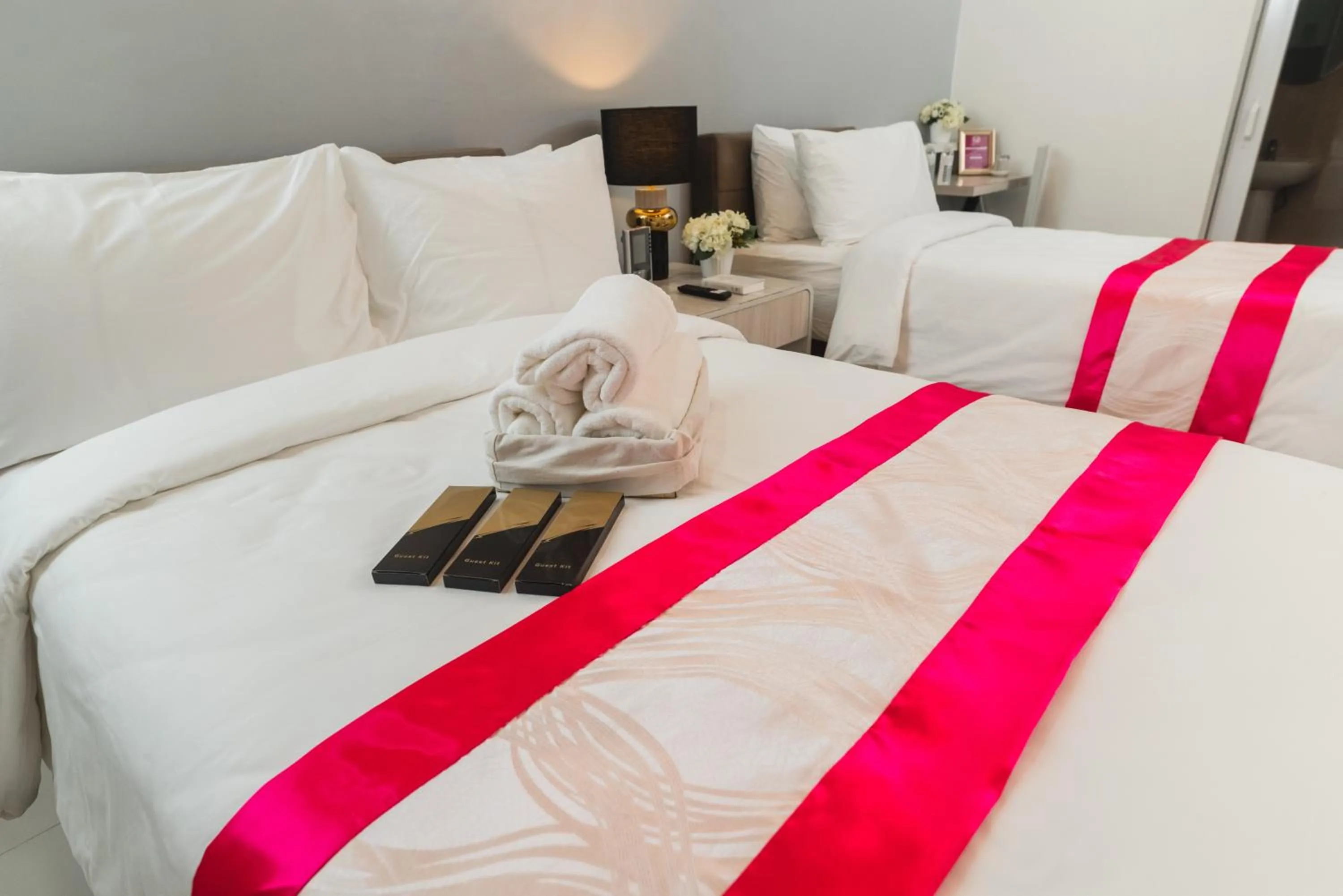 Bed in Monica Midtown Suites