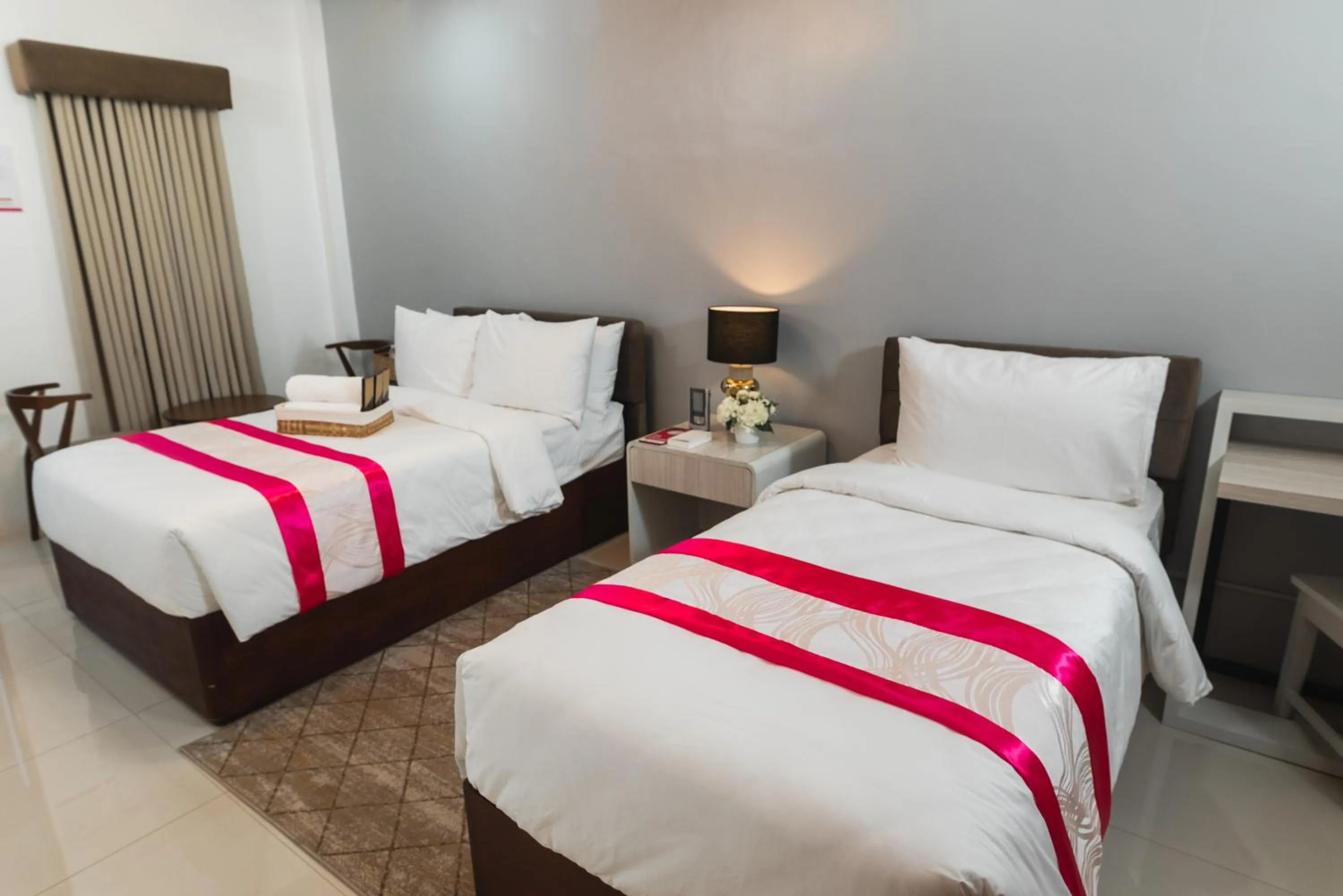 Bed in Monica Midtown Suites