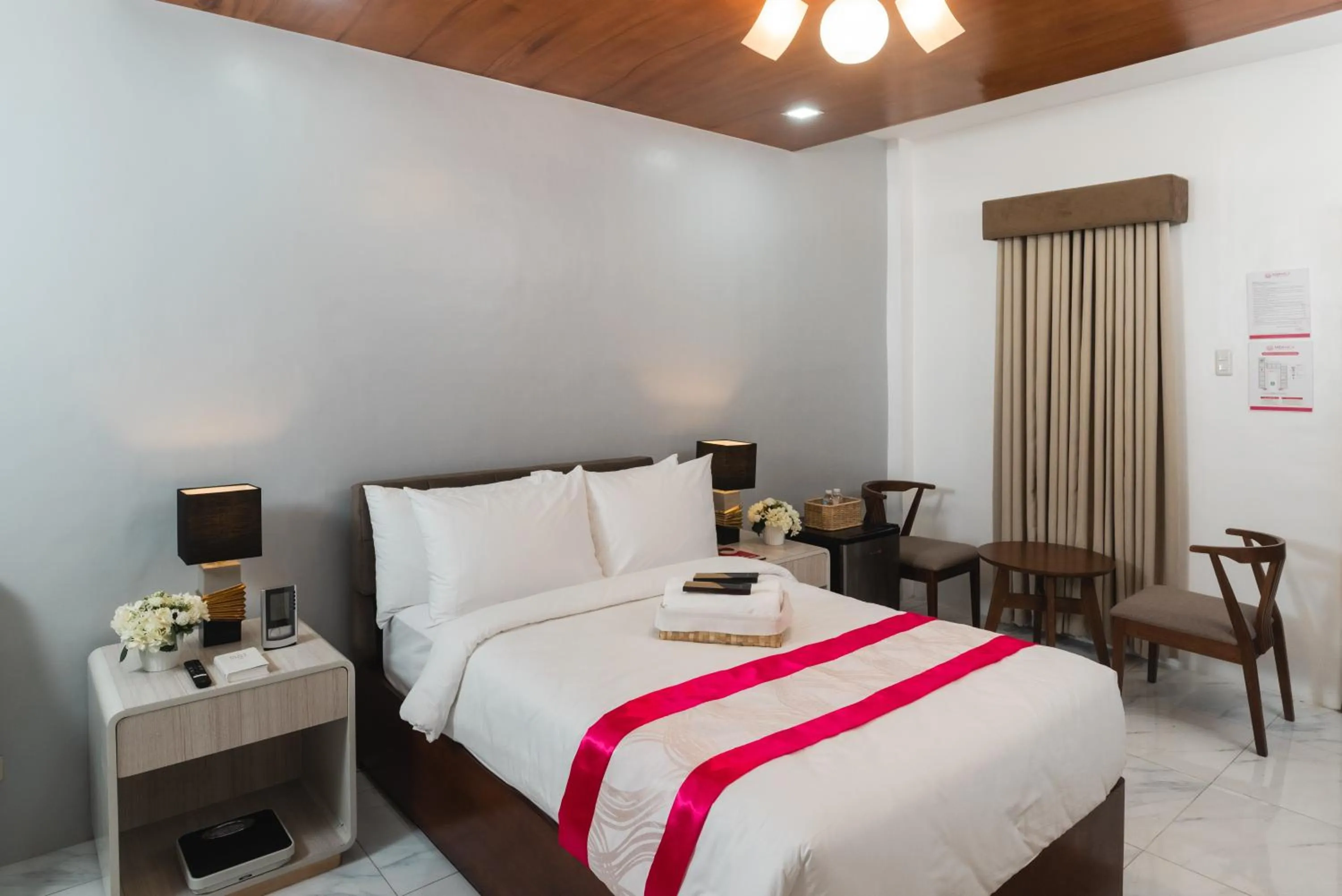 Bed in Monica Midtown Suites