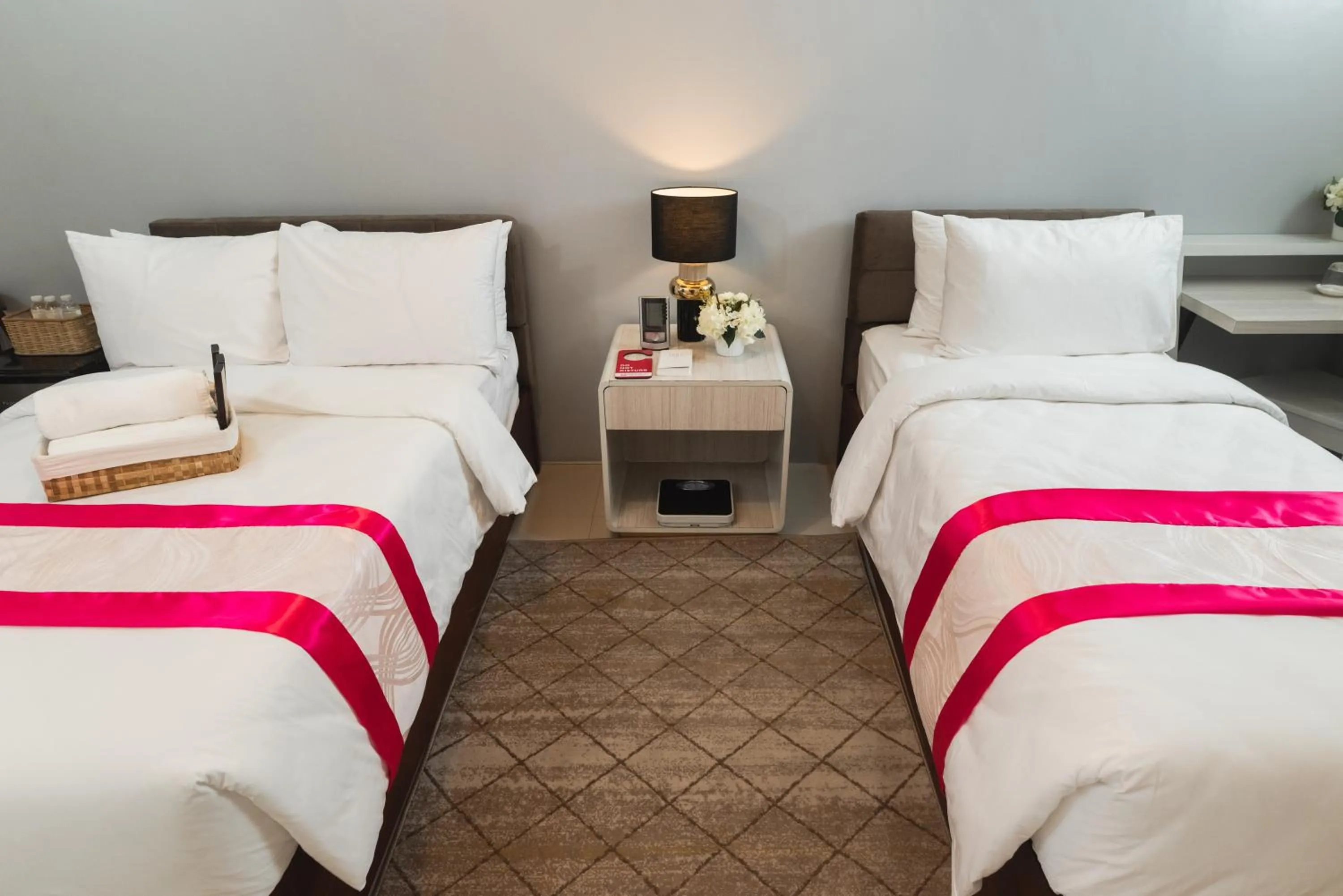 Bed in Monica Midtown Suites