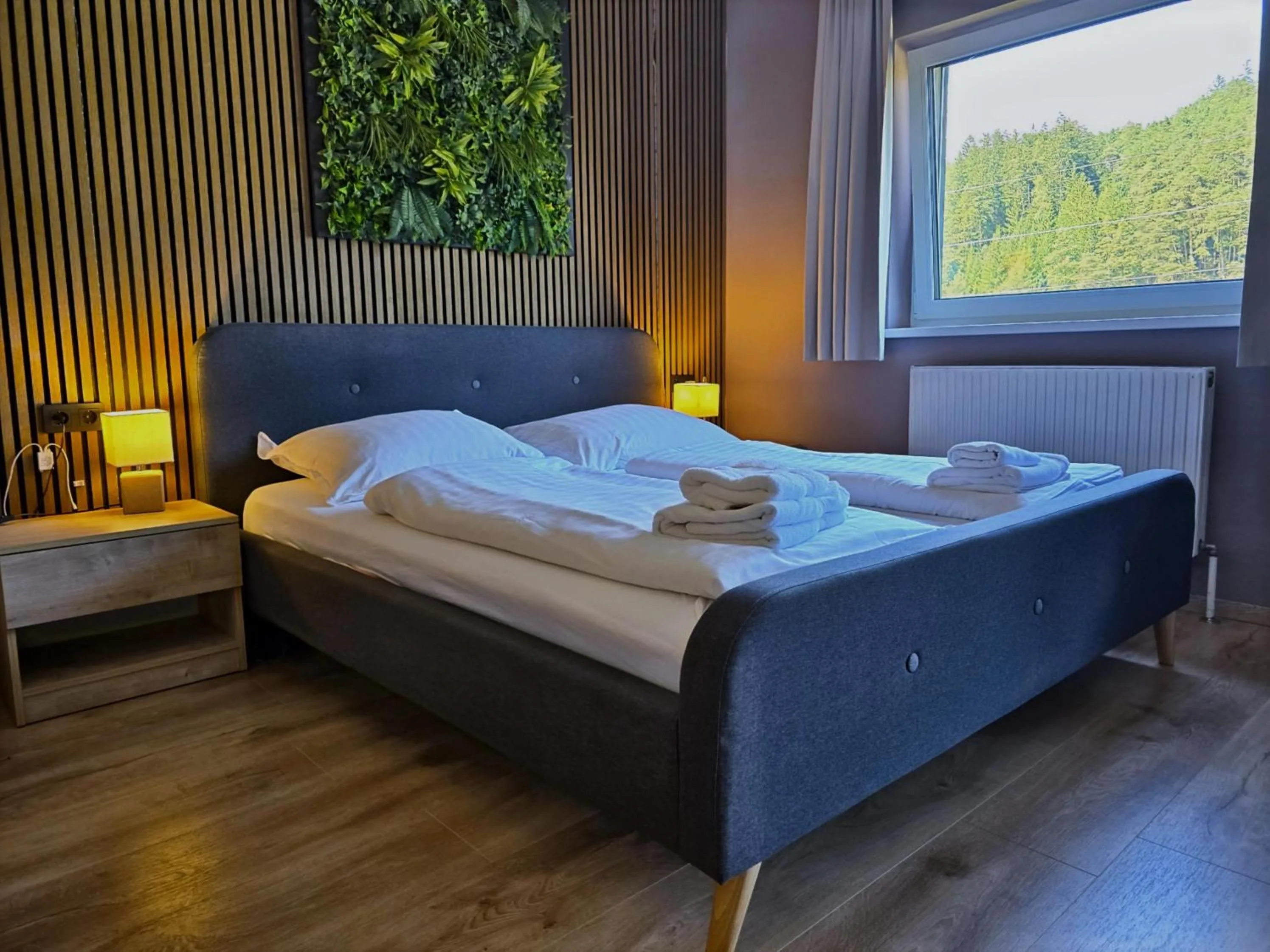 Bed in The Art and Sporthotel