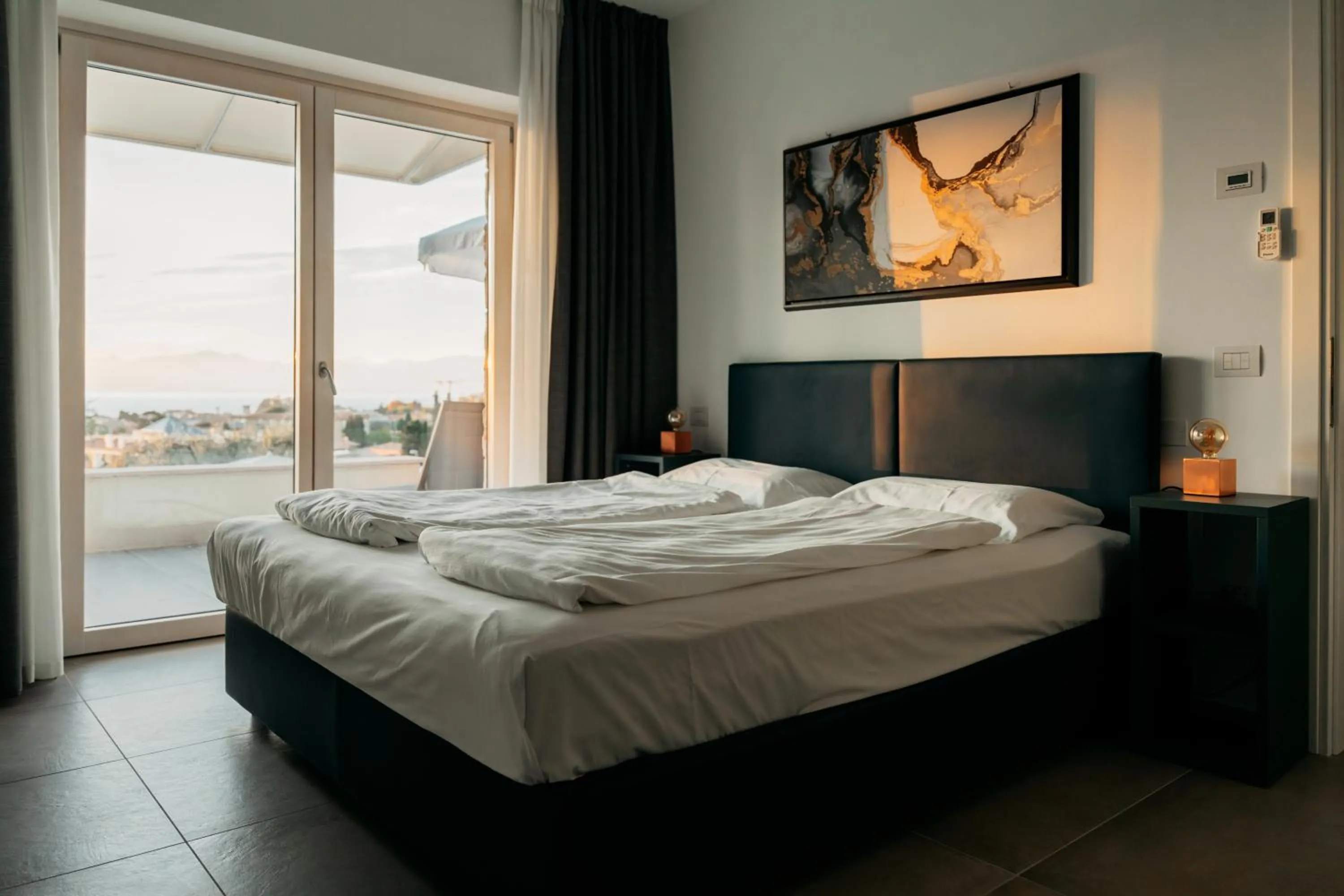 Bed in Apartments Monsurei, Lake view