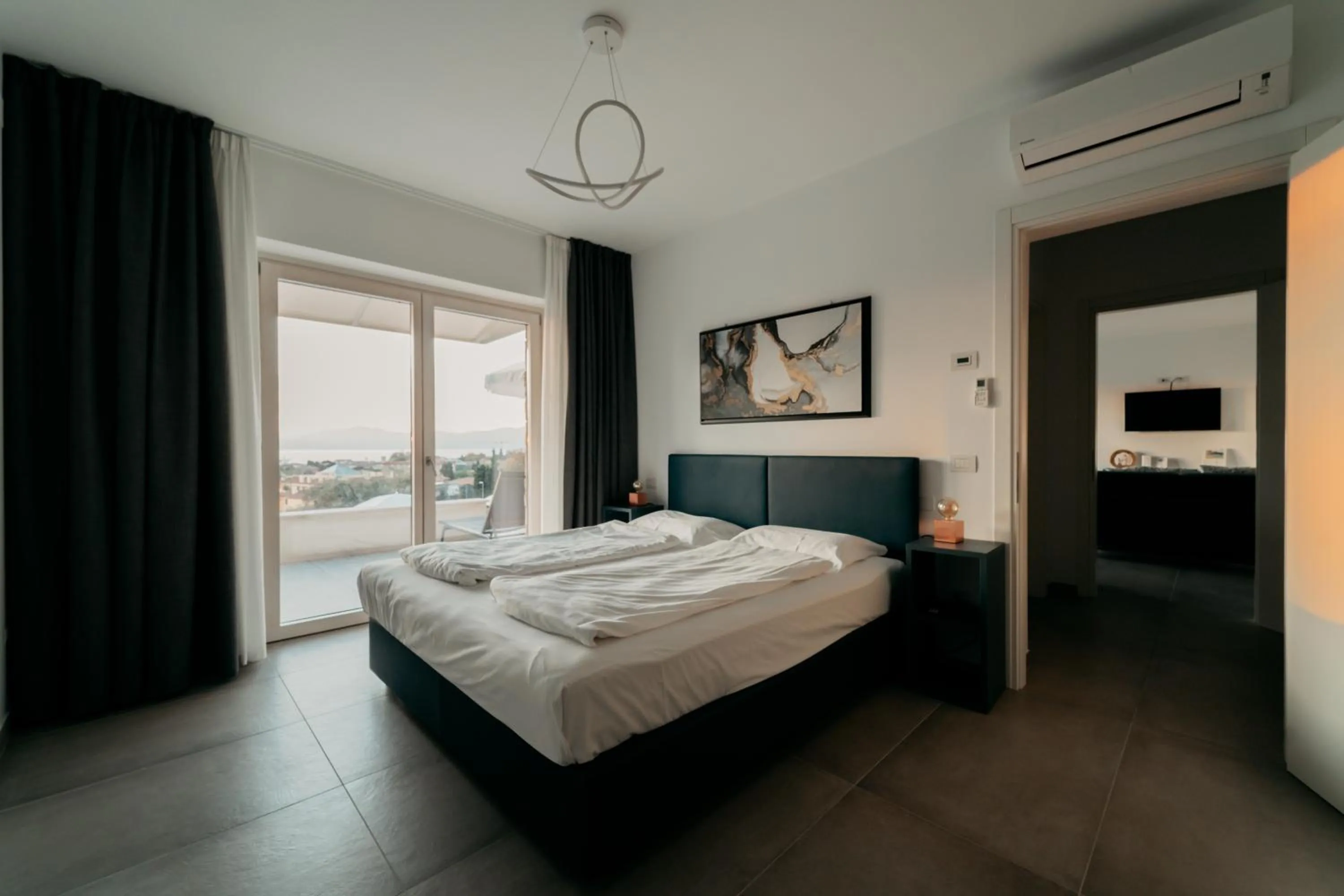 Bed in Apartments Monsurei, Lake view