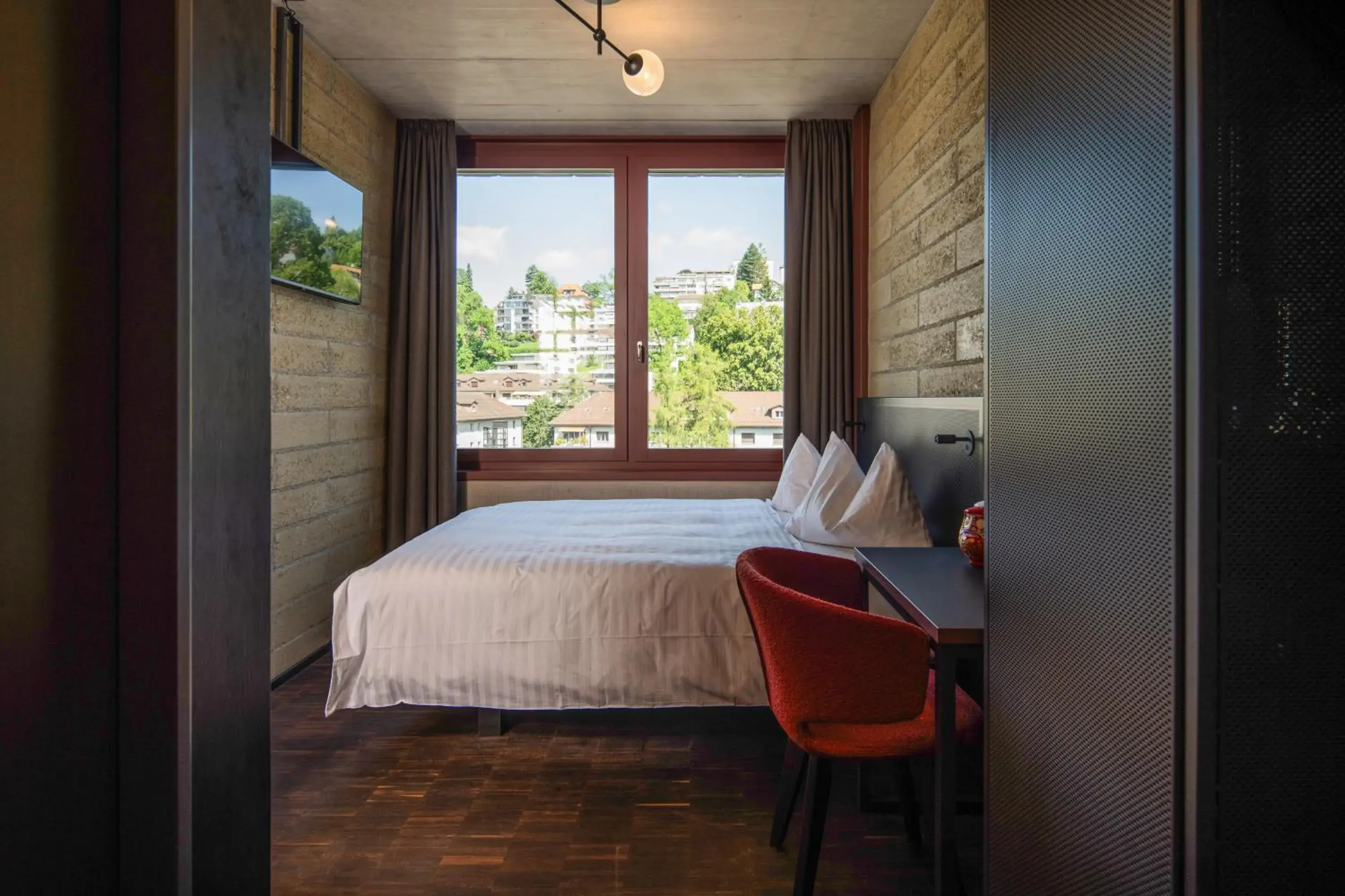 View (from property/room), Bed in Tailormade Hotel LEO St Gallen View (from property/room), Bed in Tailormade Hotel LEO St Gallen