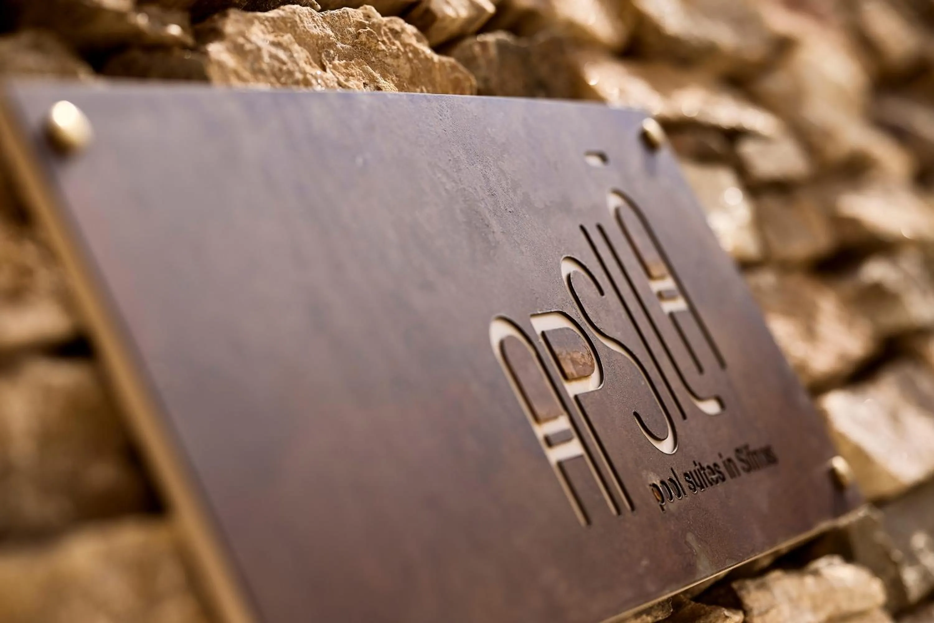Property logo or sign in Apsila Pool Suites